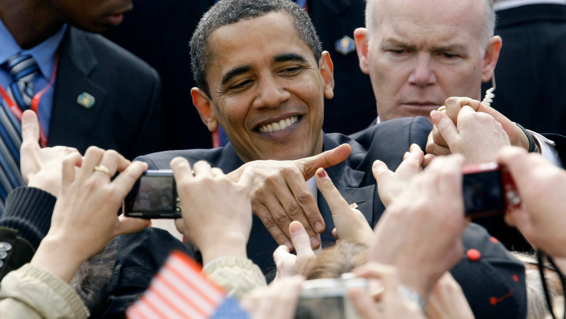 April 5, 2009. U.S. President Barack Obama shakes hands with well-wishers at Hradcanske Square in central Prague.