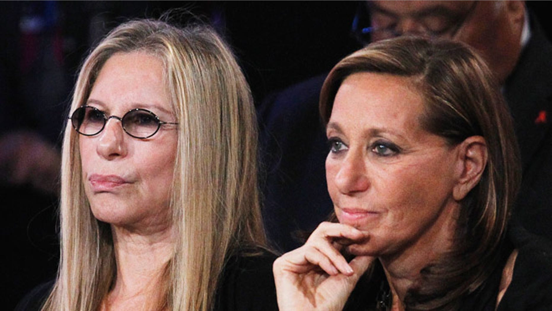 Barbra Streisand and designer Donna Karan at a political event.