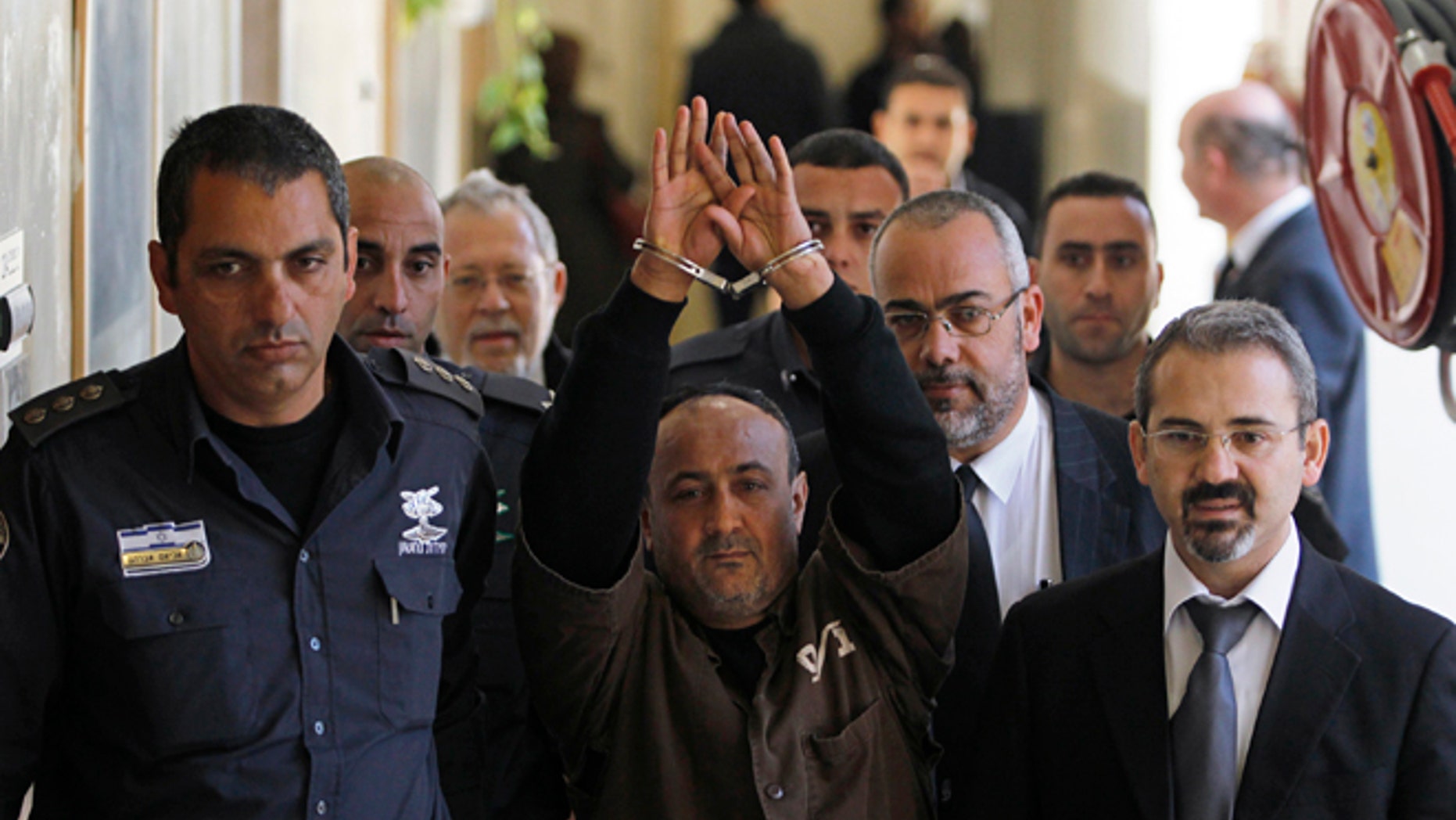 Palestinian leader Marwan Barghouti, (c.), remains wildly popular among Palestinians despited being imprisonend for life. (Reuters)