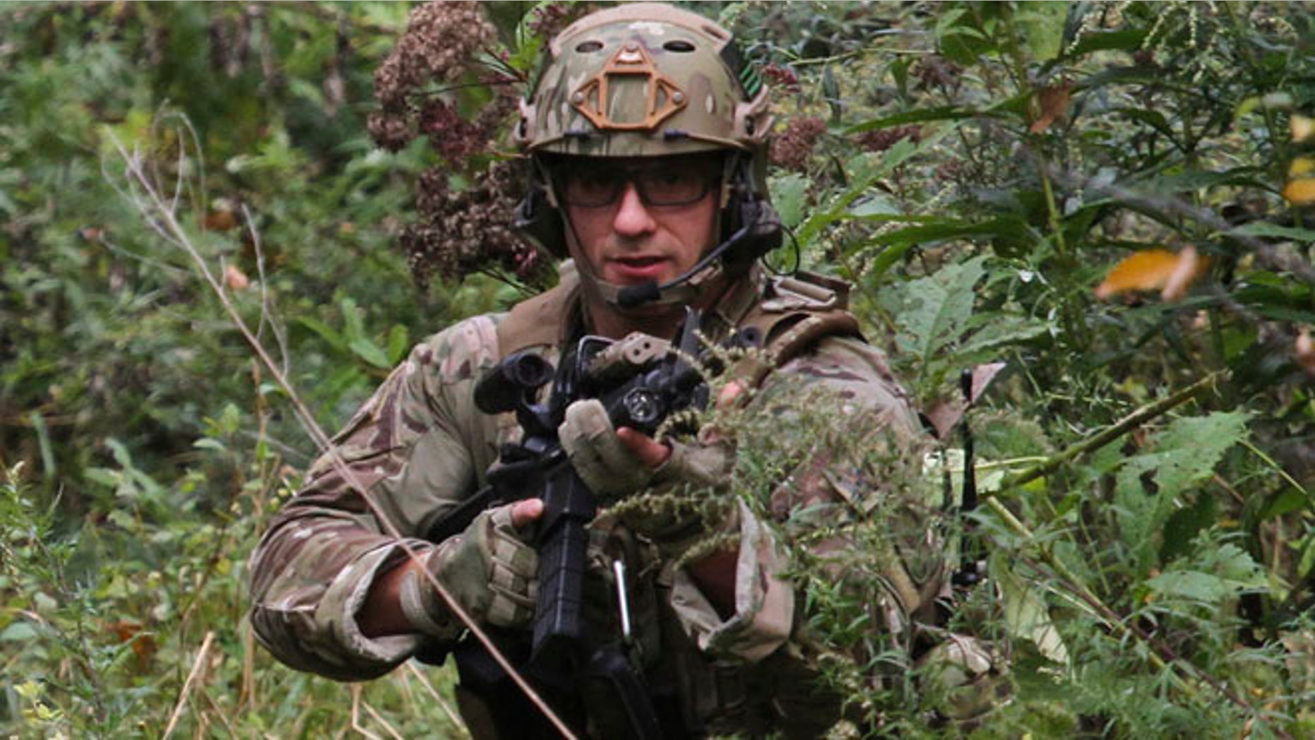 Sept. 29, 2014: A U.S. Marshal patrols along Mill Creek near Clarks Road in Barrett Township, Pa. as the search for Eric Frein continues since the Blooming Grover trooper shootings Sept 12. (AP)