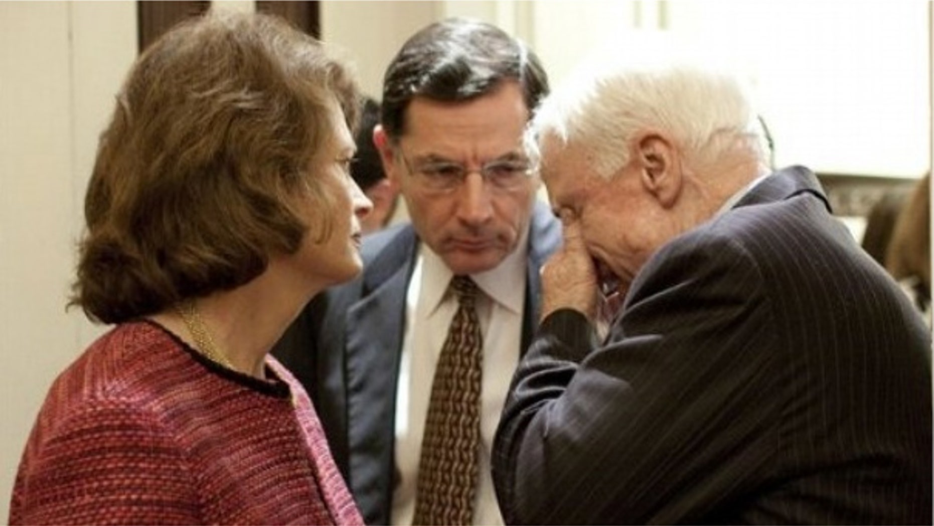 Dec. 9: Sen. John Barrasso, R-Wyo., talks with Alaska Sen. Lisa Murkowski and Arizona Sen. John McCain in a Senate hallway. (AP)