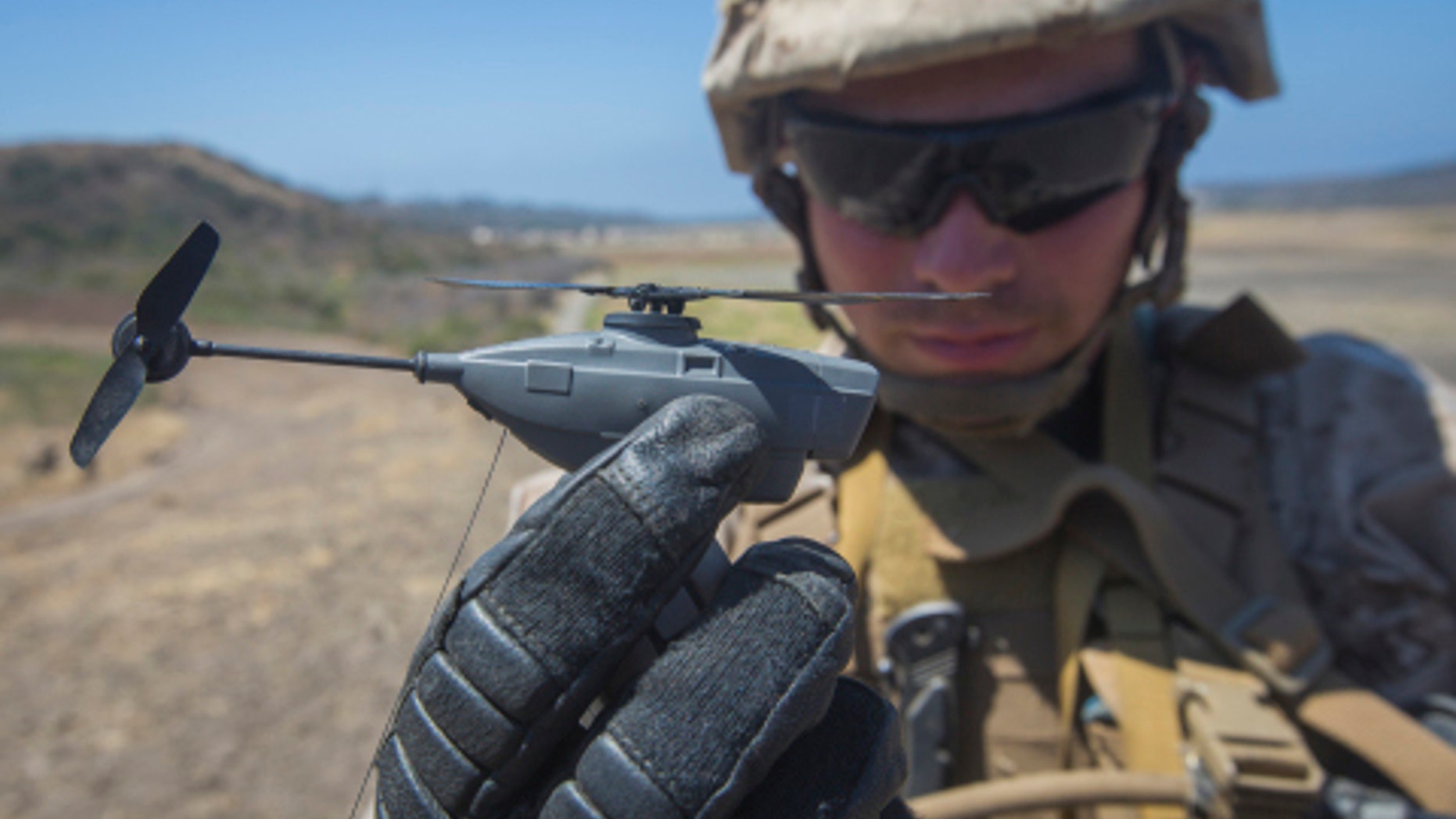 File photo - MARINE CORPS BASE CAMP PENDLETON, Calif. - U.S. Marine Lance Cpl. Cesar Salinas, an infantry Marine with Kilo Company, 3rd Battalion 5th Marine Regiment, displays the PD-100 Black Hornet after an exercise for Marine Corps Warfighting Laboratory's Marine Air-Ground Task Force Integrated Experiment on Camp Pendleton, Calif., July 9, 2016. (U.S. Marine Corps photo by Pfc. Rhita Daniel/Released)