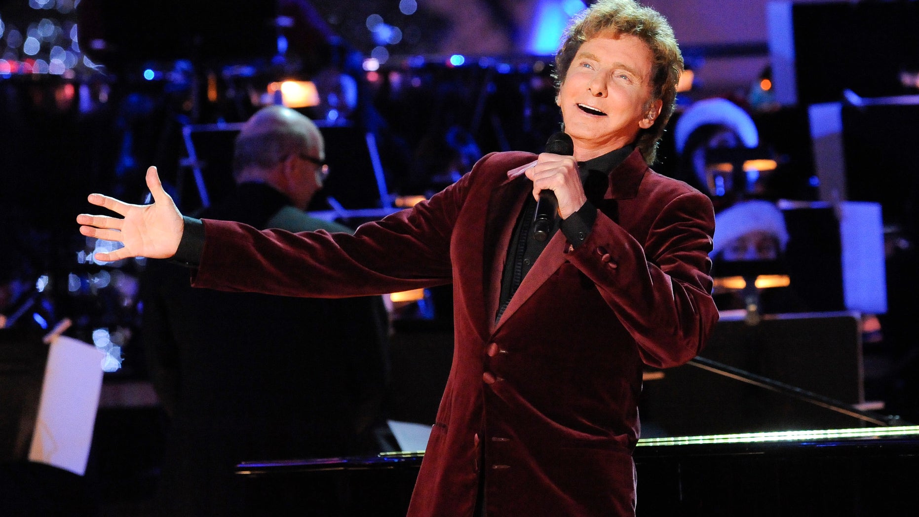 November 28, 2012. Singer Barry Manilow performs at the 5th Annual Holiday Tree Lighting at L.A. Live in Los Angeles, California.