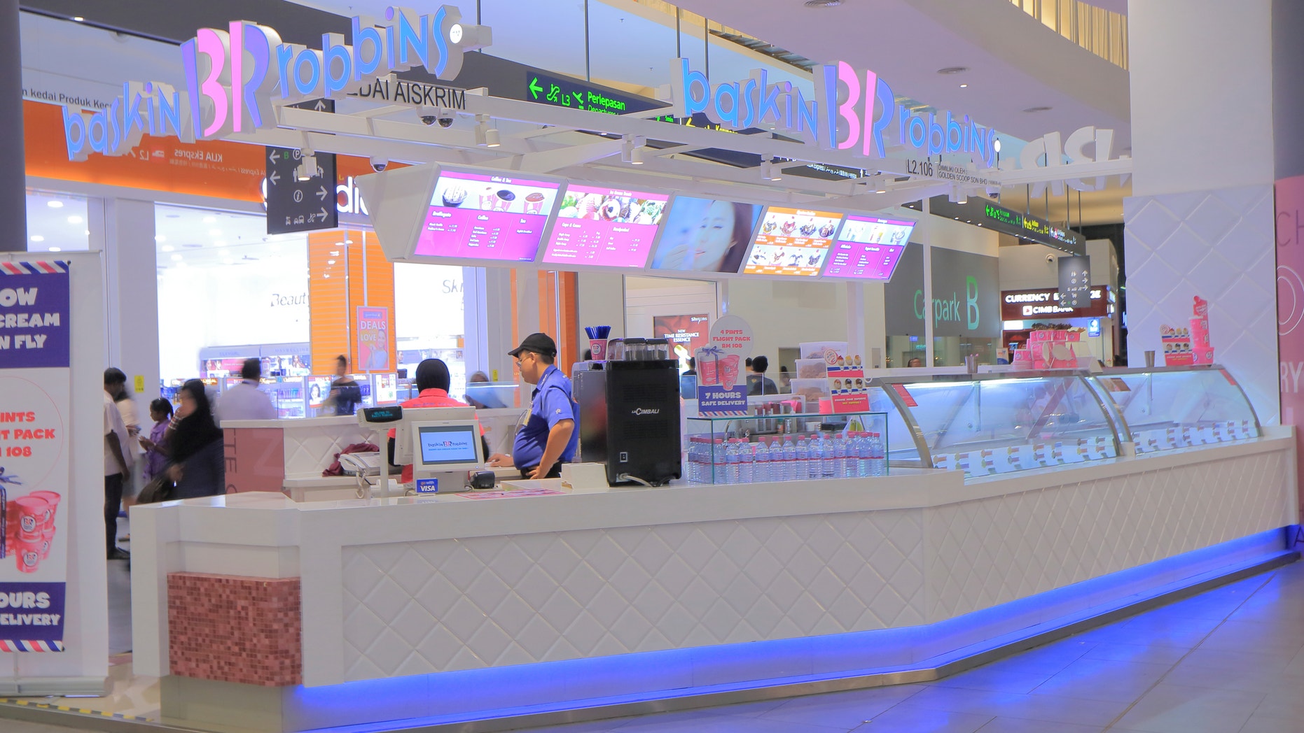 Kuala Lumpur Malaysia - September 13, 2014: People work at Baskin Robbins Ice cream shop at KLIA2 Airport in Kulala Lumpur Malaysia.