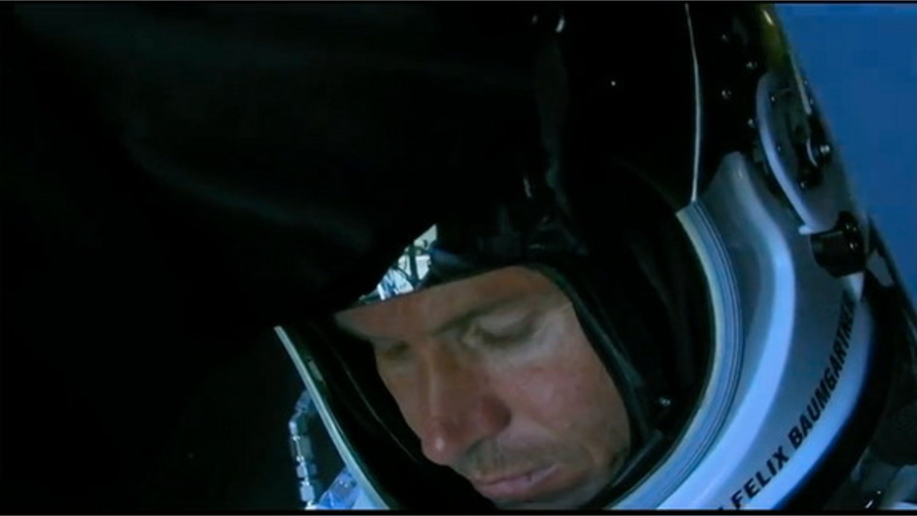 Austrian skydiver Felix Baumgartner sits in the Red Bull Stratos capsule after the space jump was called off on Oct. 9, 2012, in New Mexico.