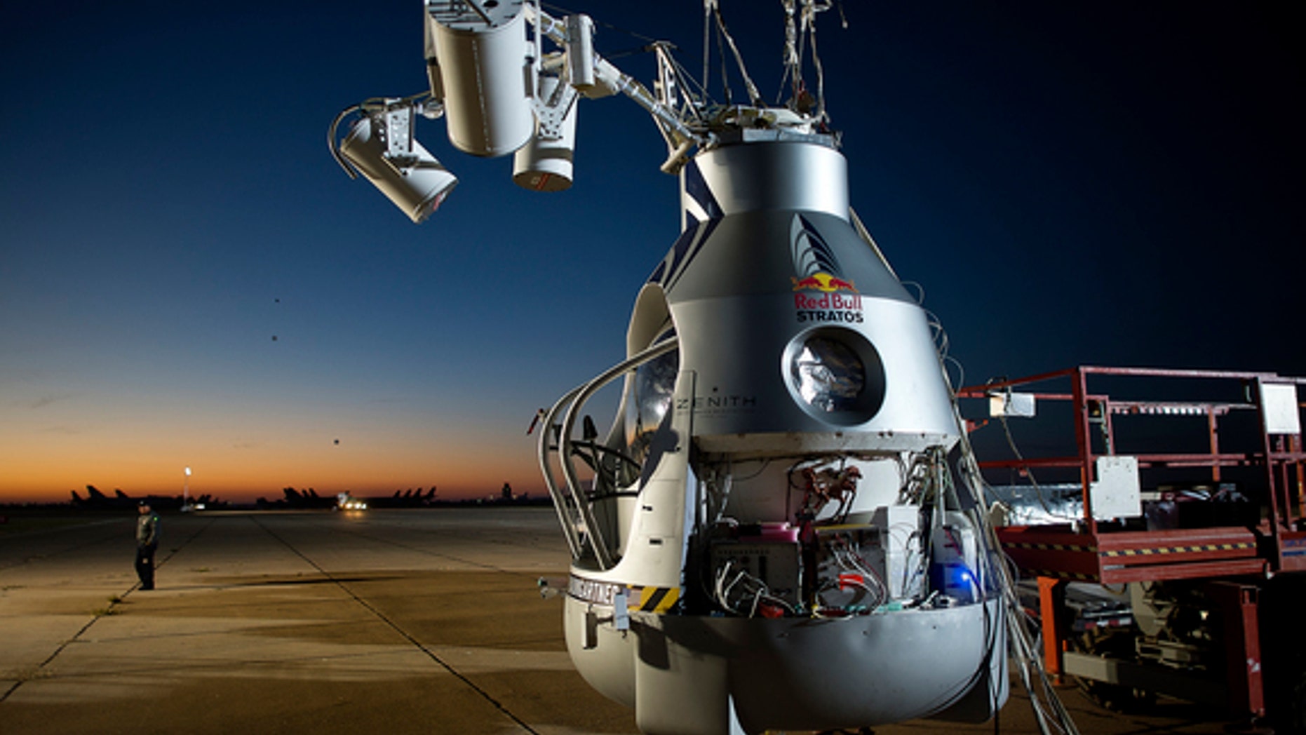 A crane holds Felix Baumgartner's capsule at the flight line in Roswell, N.M., on Oct. 9, 2012, before the daredevil attempted his record-breaking leap from the stratosphere.