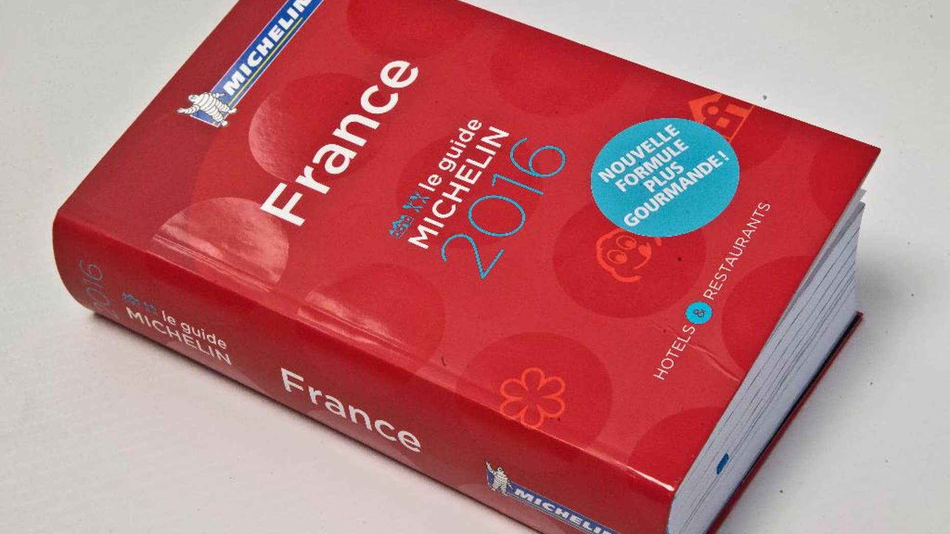 FILE - In this Feb.1, 2016 file photo, the Michelin Guide 2016 is pictured in Paris. The leader of an umbrella organization representing world Jewry has asked the Michelin travel guide company to evaluate Israeli restaurants with its famous rating system, implying that the decision to omit the country may be political. (AP Photo/Michel Euler, File)