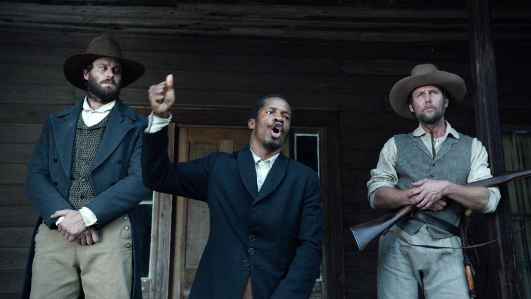 In this image released by Fox Searchlight Pictures, from left, Armie Hammer portrays Samuel Turner, Nate Parker portrays Nat Turner and Jayson Warner Smith portrays Earl Fowler in a scene from "The Birth of a Nation," opening Oct. 7, 2016. Parker said he hopes the movie will inspire people to challenge injustices worldwide and said the lecture series would help. (Fox Searchlight Pictures via AP)