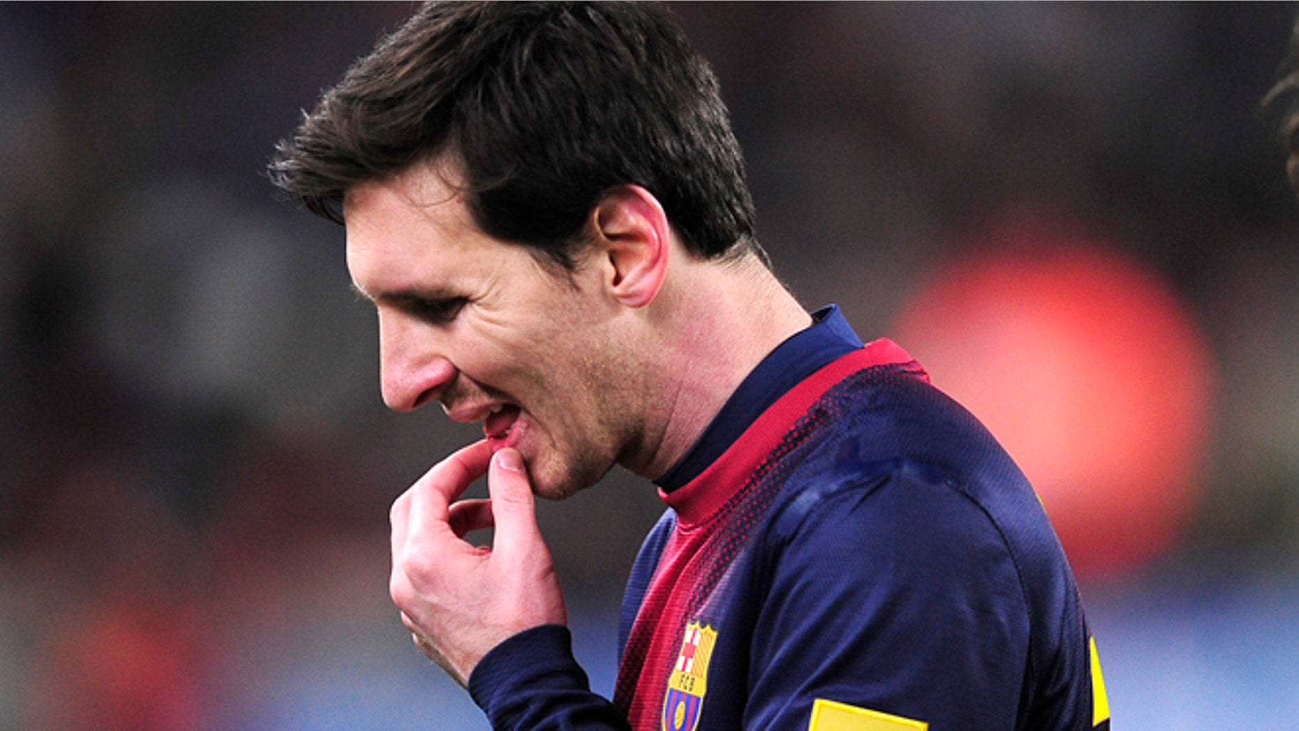 FILE - In this Feb. 26, 2013 file photo, Barcelona's Lionel Messi from Argentina reacts after losing the Copa del Rey soccer match between FC Barcelona and Real Madrid at the Camp Nou stadium in Barcelona, Spain. A state prosecutor for the northeastern region of Catalonia has lodged on Wednesday June 12, 2013, a lawsuit against Lionel Messi for fraud in unpaid income tax amounting to euro4 million ($5.3 million). The complaint, signed by prosecutor Raquel Amado, has been submitted for trial at the courthouse in Gava, the upscale Barcelona district where the Argentina forward lives. The document, presented to the court on Wednesday, brings a lawsuit against Barcelona star Messi and his father, Jorge Horacio Messi.(AP Photo/Manu Fernandez, File)
