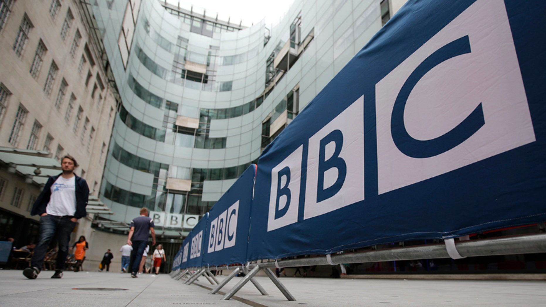 July 16, 2015: BBC workers place barriers near to the main entrance of the BBC headquarters and studios in Portland Place, London.