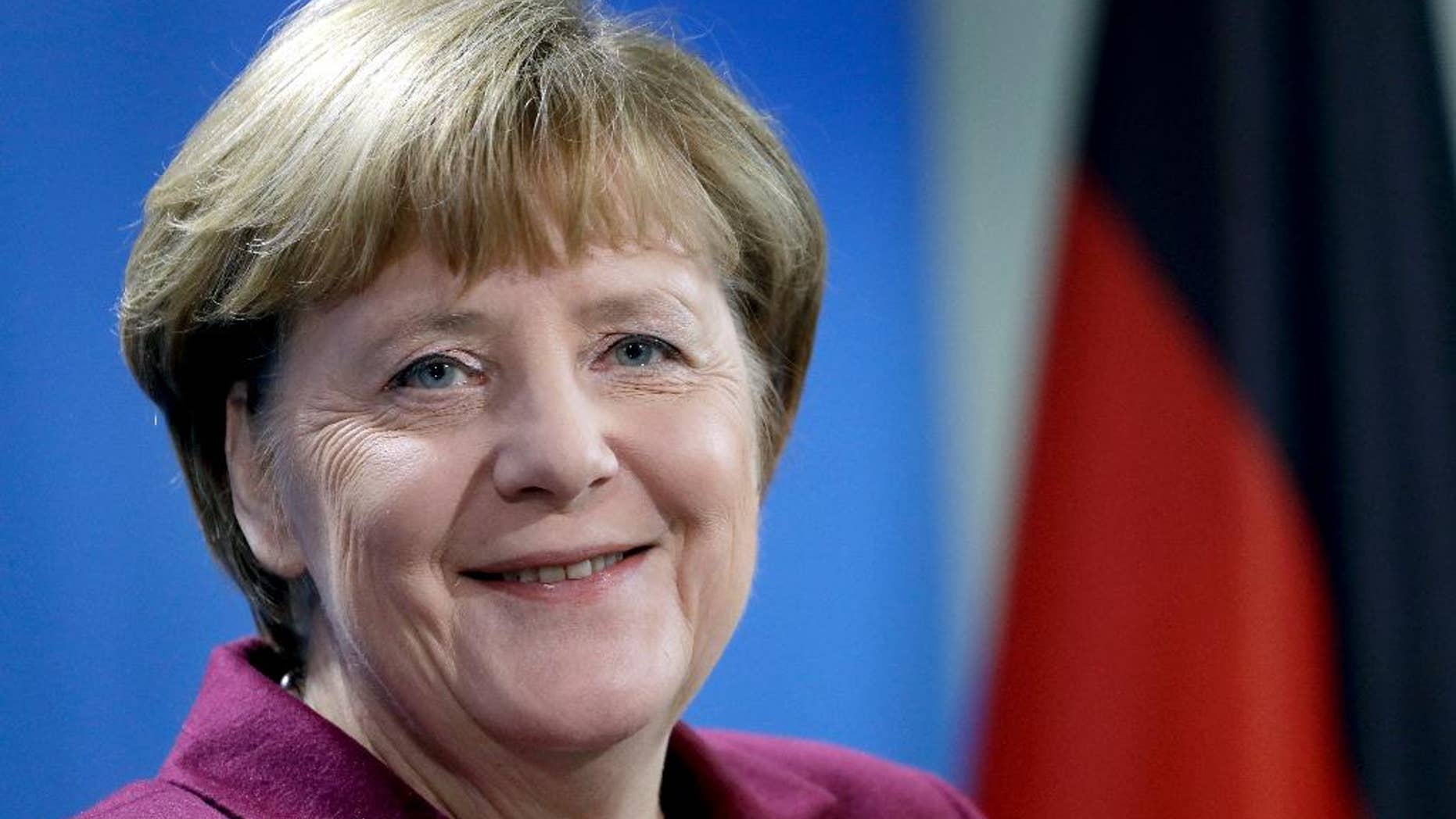 FILE - In this Nov. 8, 2016 file photo German Chancellor Angela Merkel smiles during a joint news conference as part of a meeting with the Prime Minister of Norway, Erna Solberg, at the chancellery in Berlin, Germany. (AP Photo/Michael Sohn, file)