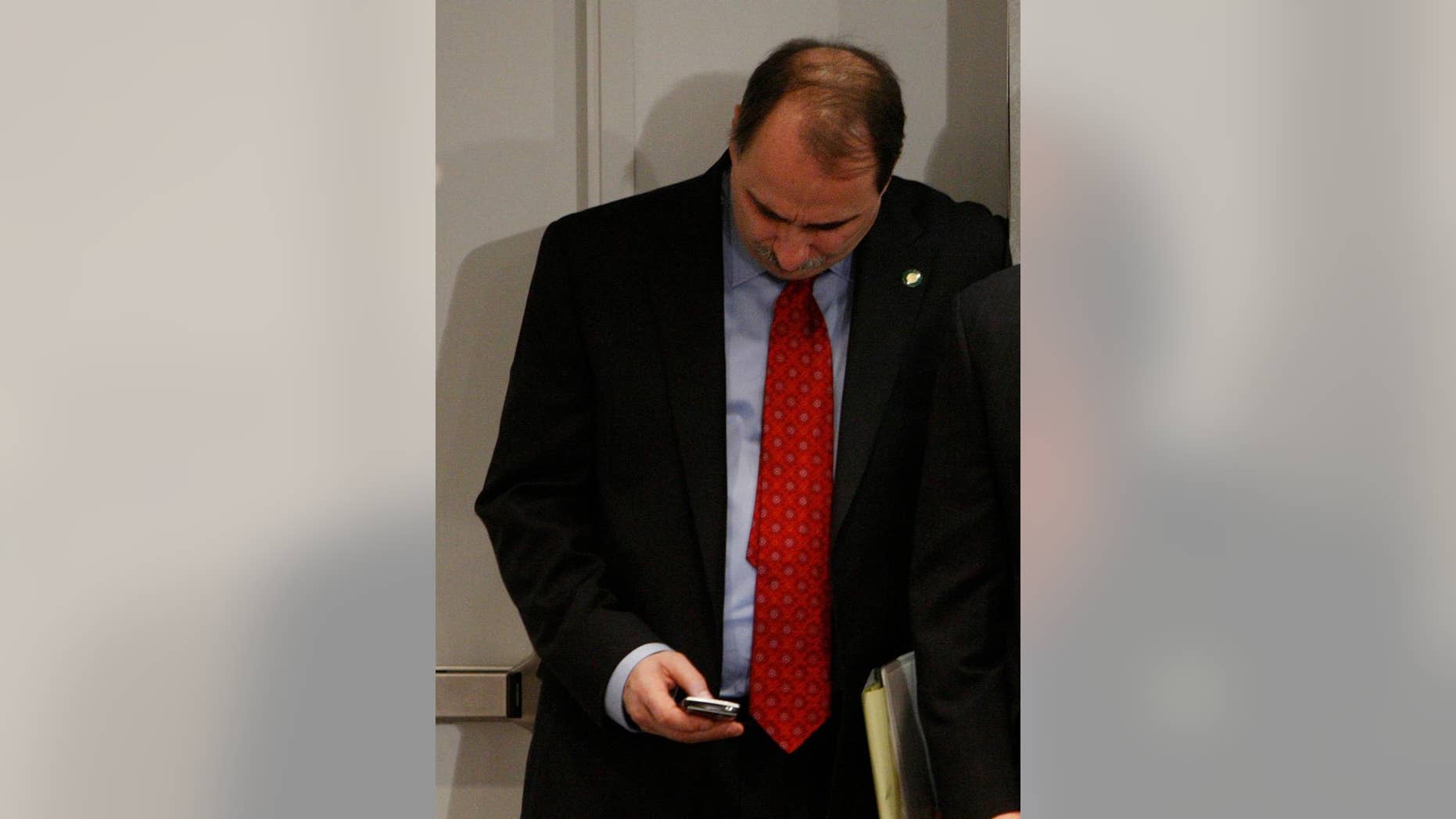 In this Jan. 9, 2009 file photo, David Axelrod checks his BlackBerry E-Mail device at the White House (AP Photo/Charles Dharapak. File)