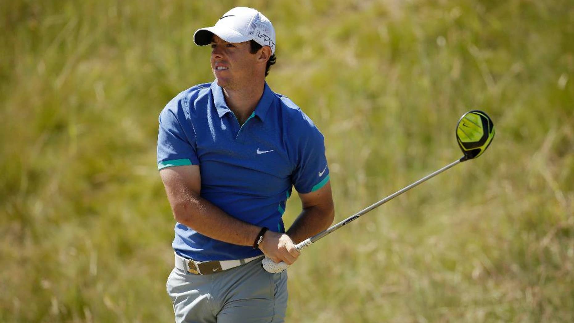 Rory McIlroy, of Northern Ireland, watches his tee shot on the seventh hole during the third round of the U.S. Open golf tournament at Chambers Bay on Saturday, June 20, 2015 in University Place, Wash. (AP Photo/Charlie Riedel)