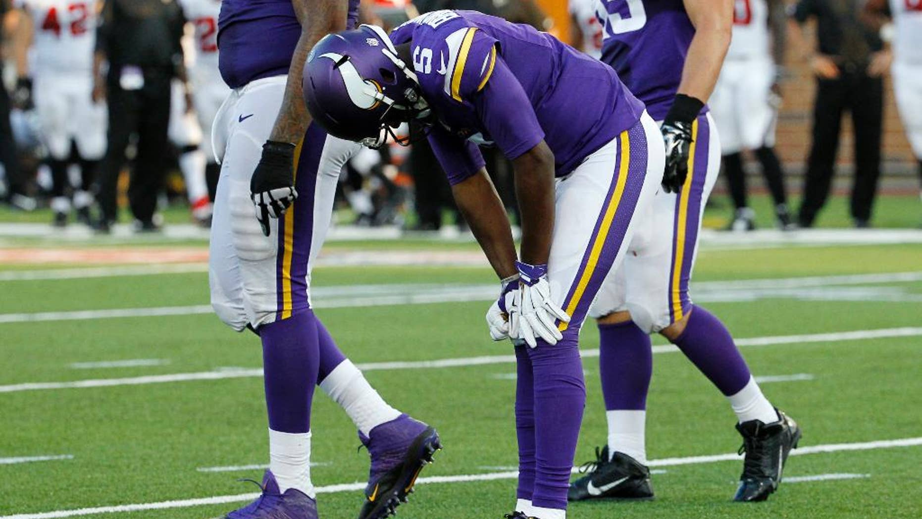 FILE - In this Sunday, Sept. 28, 2014, file photo, Minnesota Vikings quarterback Teddy Bridgewater (5) reacts after getting injured during the second half of an NFL football game against the Atlanta Falcons in Minneapolis. Bridgewater's first start for the Minnesota Vikings couldn't have been better, except of course for the sprained left ankle in the fourth quarter that forced him out of the 41-28 victory over Atlanta.(AP Photo/Ann Heisenfelt, File)