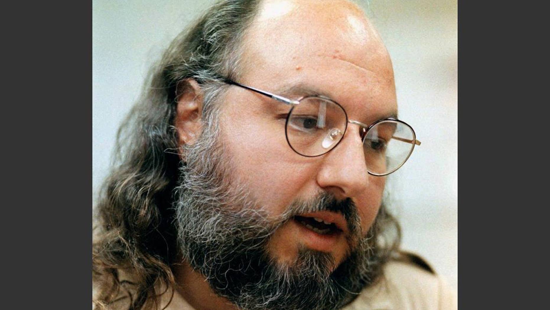 FILE - In this May 15, 1998, file photo, Jonathan Pollard speaks during an interview in a conference room at the Federal Correction Institution in Butner, N.C. Lawyers for the convicted spy Pollard say the U.S. has granted his parole and he will be released in November 2015. Pollard, sentenced to life in prison, has served 30 years for spying for Israel. (AP Photo/Karl DeBlaker, File)