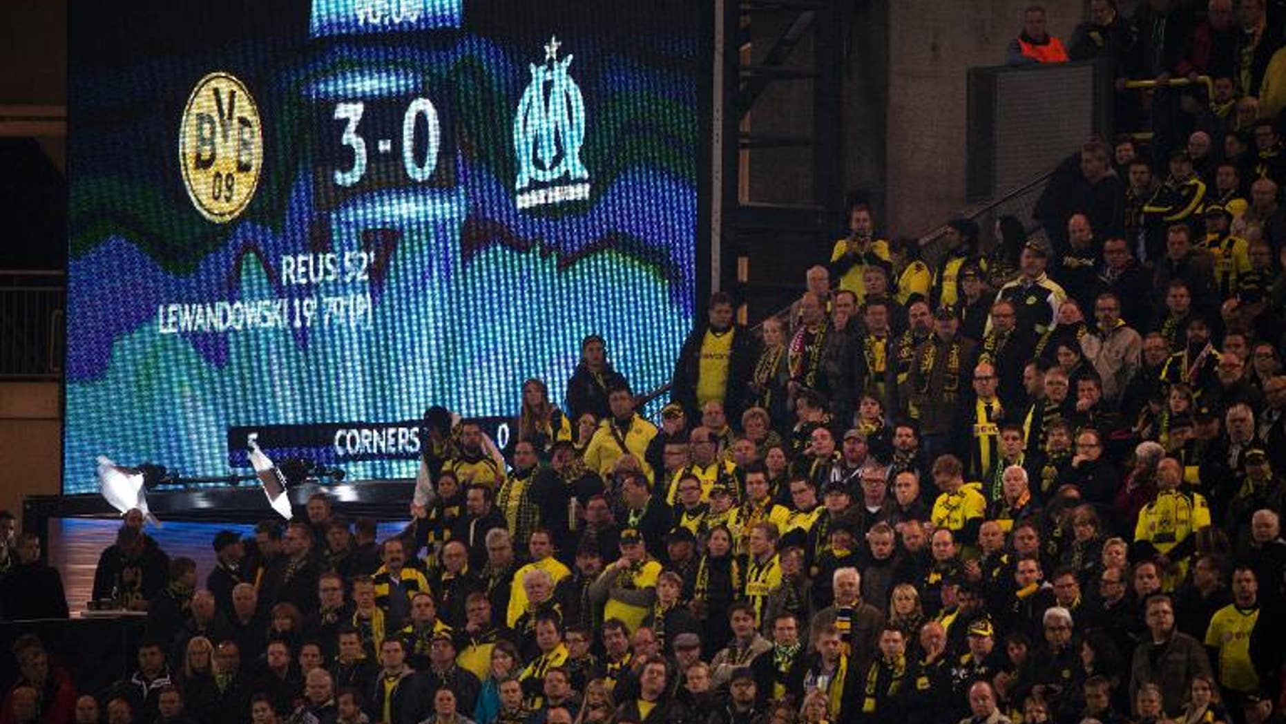 An electronic billboard shows the final score after the UEFA Champions League Group F football match Borussia Dortmund vs Olympique Marseille in Dortmund, western Germany on October 1, 2013