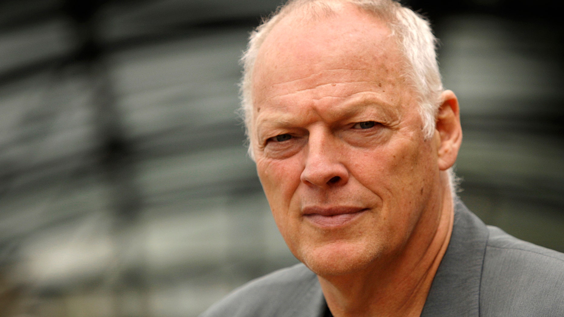 FILE - An Aug. 13, 2008, file photo is of former Pink Floyd band member David Gilmour in London. Police say a 53-year-old man who went to a Minnesota hospital for treatment on April 20, 2013, is accused of pretending to be singer-guitarist David Gilmour _ and racking up as much as $100,000 in unpaid medical bills. Authorities say the man didn't have health insurance, was treated and released, but not before signing an autograph. (AP Photo/Joel Ryan, File)