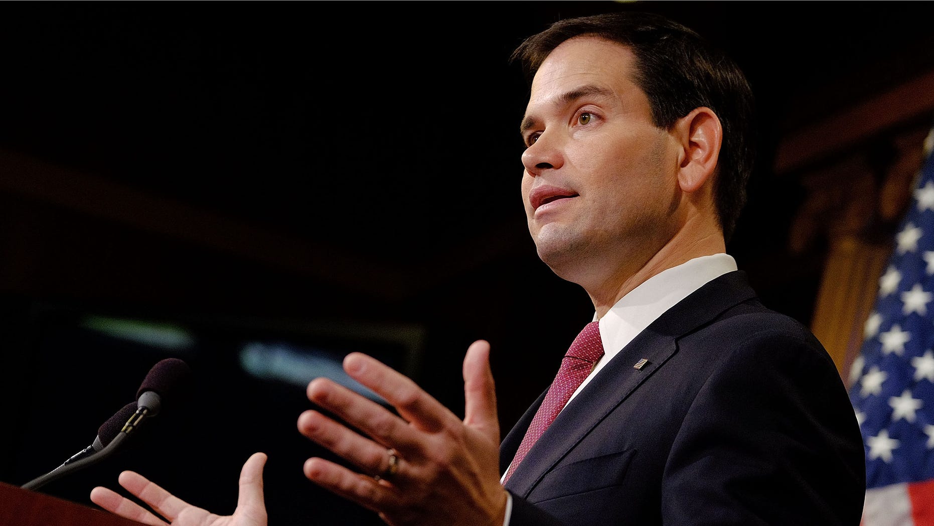 WASHINGTON, DC - DECEMBER 17: Sen. Marco Rubio (R-FL) reacts to U.S. President Barack Obama's announcement about revising policies on U.S.-Cuba relations on December 17, 2014 in Washington, DC. Rubio called the President a bad negotiator and criticized what he claimed was a deal with no democratic advances for Cuba. (Photo by T.J. Kirkpatrick/Getty Images)