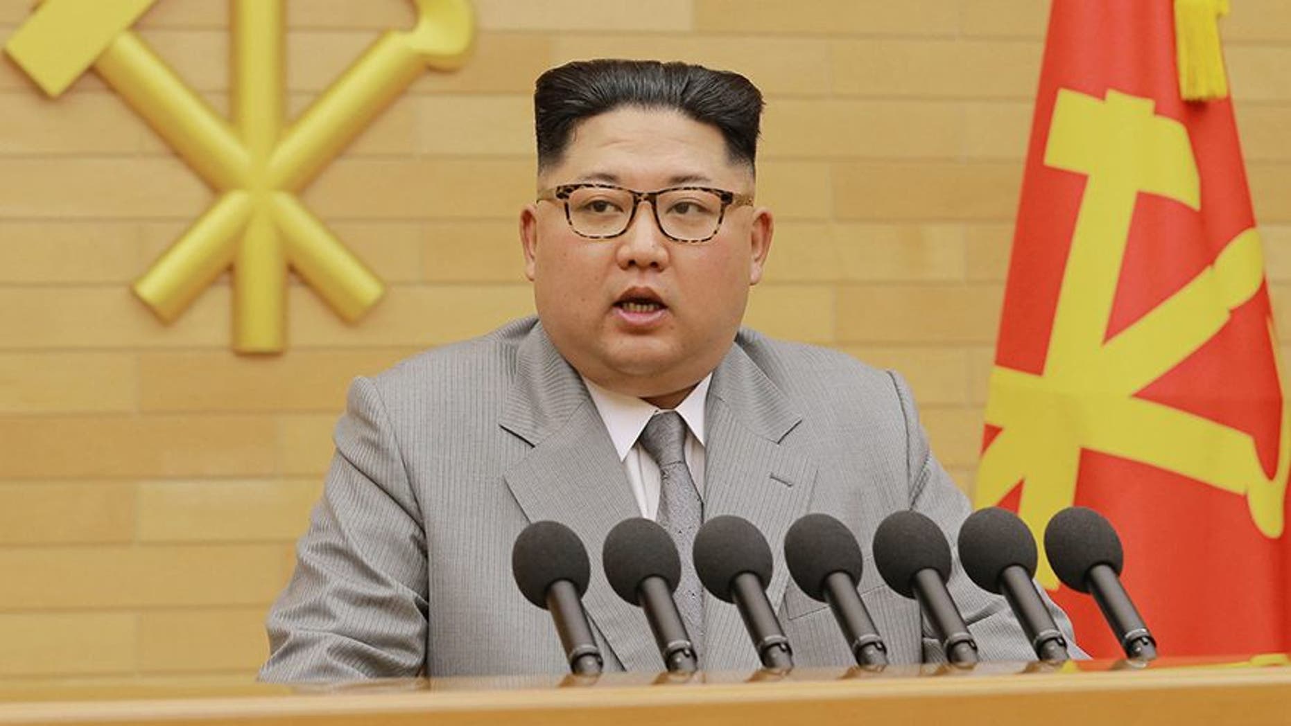 In this photo provided by the North Korean government, North Korean leader Kim Jong Un delivers his New Year's speech at an undisclosed place in North Korea Monday, Jan. 1, 2018. Kim said Monday the United States should be aware that his country's nuclear forces are now a reality, not a threat. Independent journalists were not given access to cover the event depicted in this image distributed by the North Korean government. The content of this image is as provided and cannot be independently verified. Korean language watermark on image as provided by source reads: "KCNA" which is the abbreviation for Korean Central News Agency. (Korean Central News Agency/Korea News Service via AP)