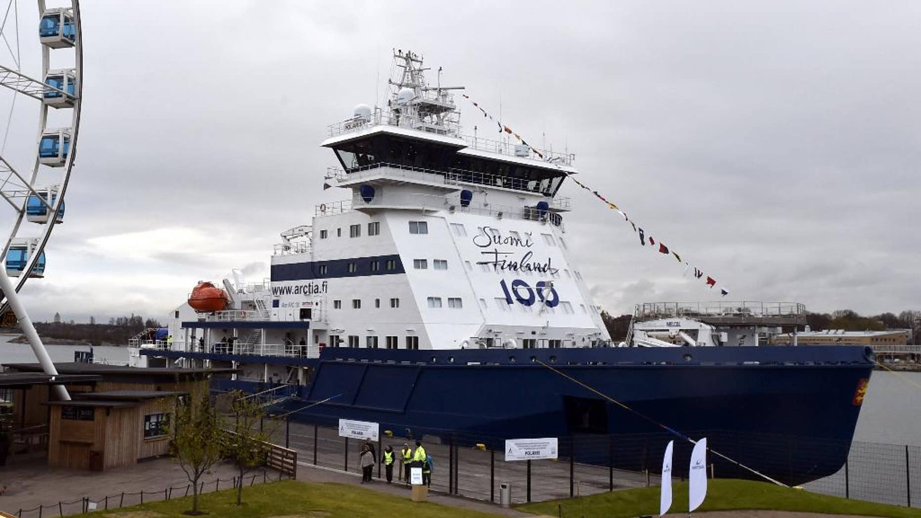 Finnish icebreaker Polaris is presented to the media on the Katajanokka Pier in Helsinki, Finland, Monday Oct. 31, 2016. Finland says it will start to operate the world's first icebreaker powered by liquefied natural gas as the number of LNG-powered vessels is steadily increasing in the Nordic country that is surrounded by the Baltic Sea and is heavily reliant on maritime transport. (Jussi Nukari/Lehtikuva via AP)