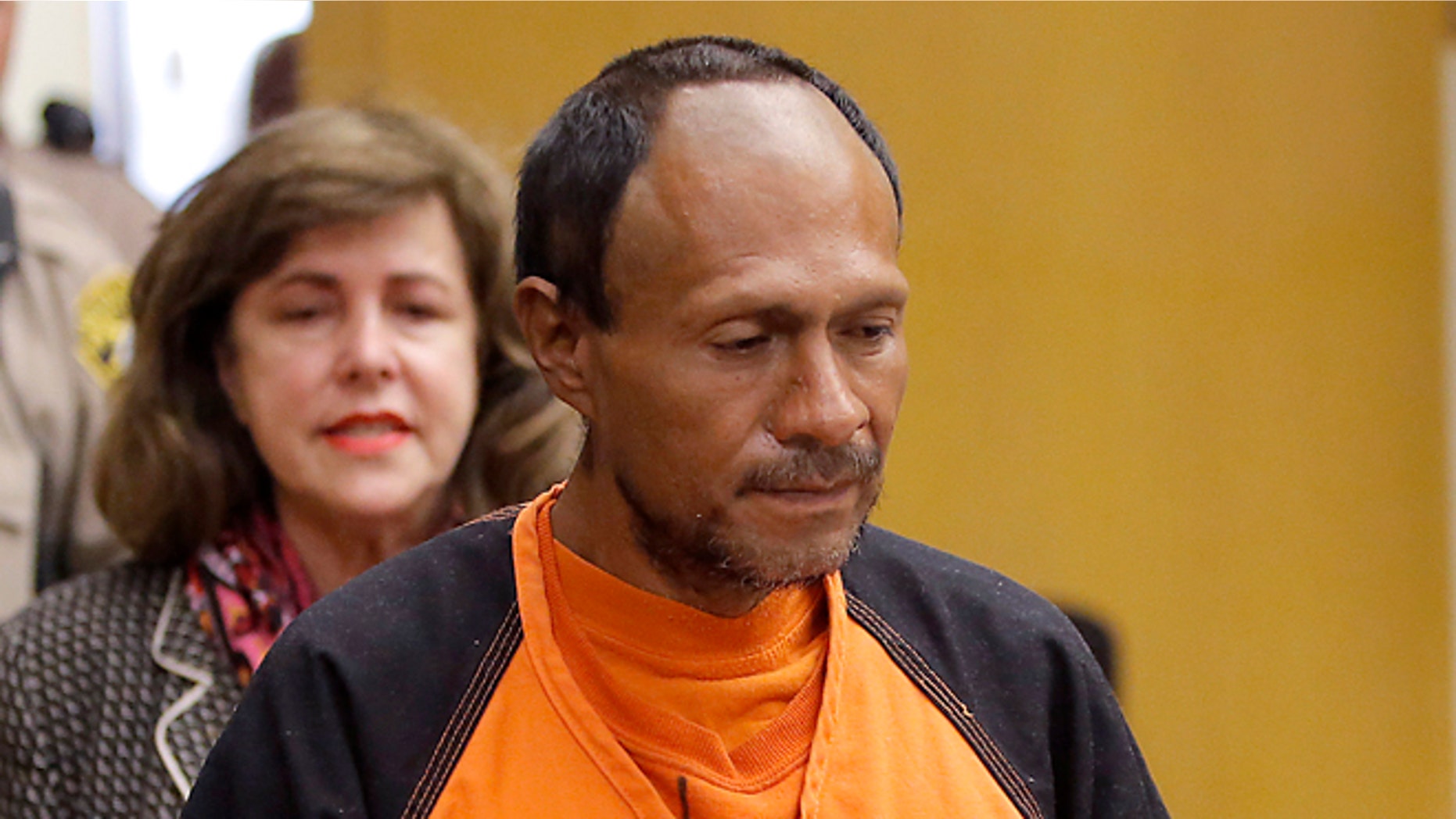 Francisco Sanchez, right, is lead into the courtroom by San Francisco Public Defender Jeff Adachi, left, and Assistant District Attorney Diana Garciaor, center, for his arraignment at the Hall of Justice on Tuesday, July 7, 2015 in San Francisco. Prosecutors have charged the Mexican immigrant with murder in the waterfront shooting death of 32-year-old Kathryn Steinle. (Michael Macor/San Francisco Chronicle via AP, Pool)