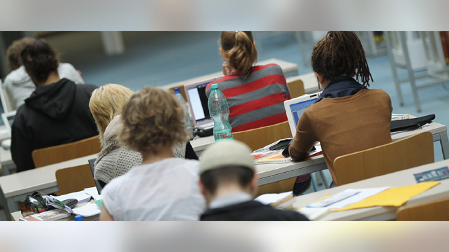 BERLIN, GERMANY - SEPTEMBER 20: Students study with their laptop computers in the Pedagogical Library at the Freie Universitaet university on September 20, 2011 in Berlin, Germany. German universities recorded a record 2.218 million matriculations in the 2010/2011 winter semester, a rise of 4.5%, and expect even more students in the coming winter semster, which starts in October. The end of compulsory military service in the Bundeswehr, the German armed forces, which went into effect earlier this year, is a major contributing factor to the rise in the numbers of students arriving at universities across the country. (Photo by Sean Gallup/Getty Images)