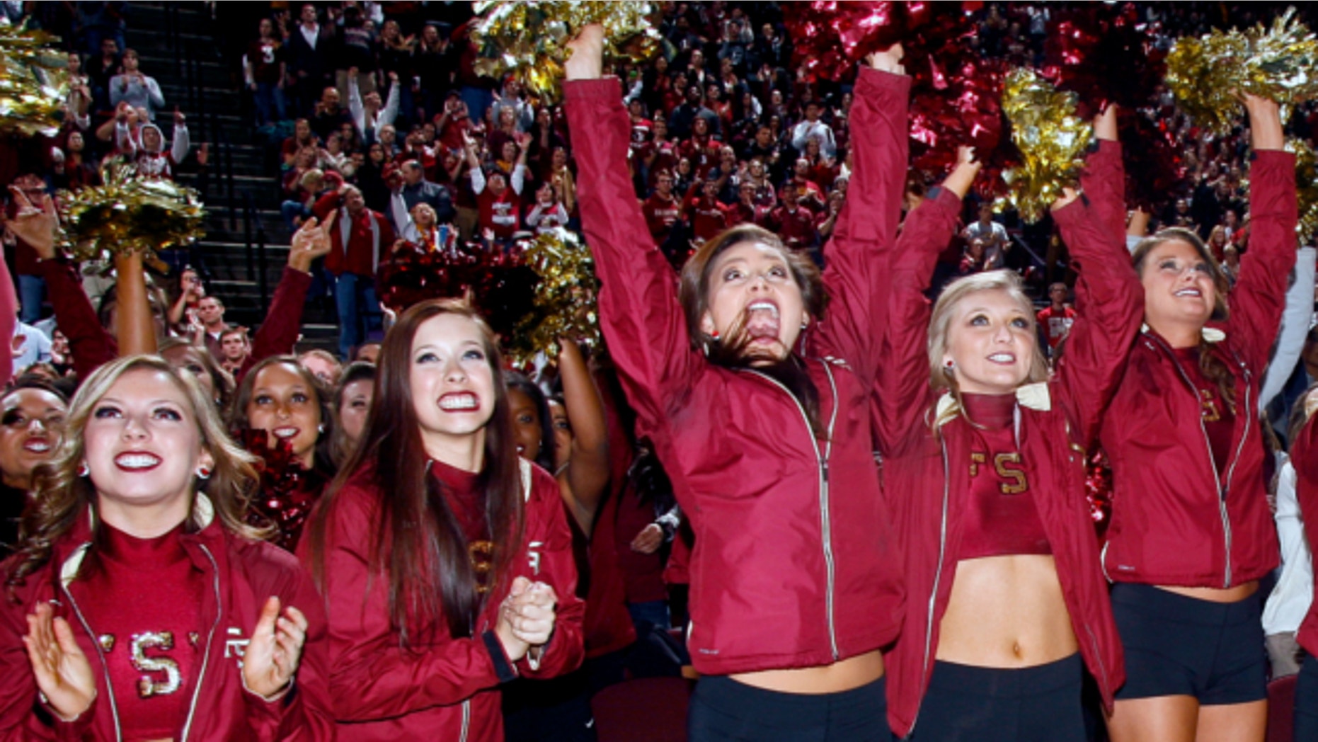 Jan. 6, 2014: Florida State Golden Girls cheerleaders react as they watch Florida State score a touchdown on a 30-foot screen at the Tallahassee Leon County Civic Center in Tallahassee, Fla. in the second quarter of the NCAA BCS National Championship college football game against Auburn.
