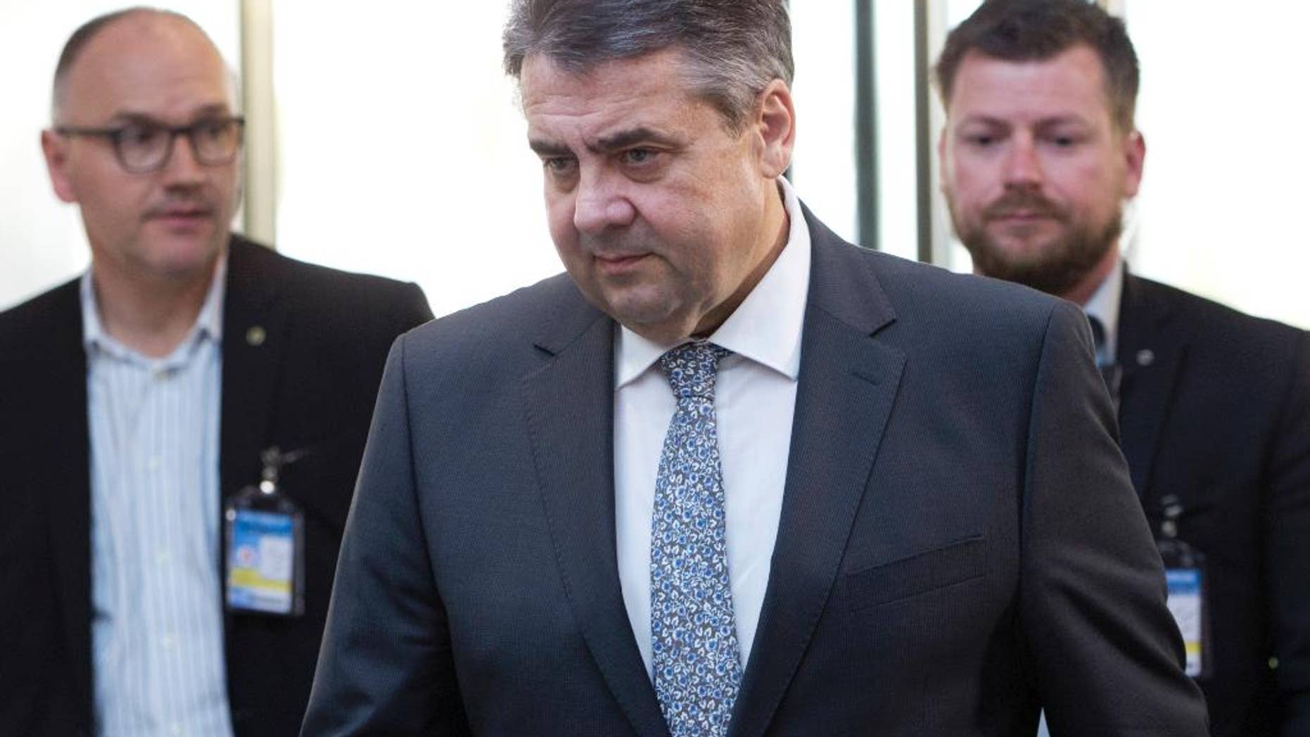 German Foreign Minister Sigmar Gabriel, center, arrives for a meeting of NATO foreign ministers at NATO headquarters in Brussels on Friday, March 31, 2017. U.S. Secretary of State Rex Tillerson meets with his NATO counterparts in Brussels for the first time looking to persuade reluctant allies to increase defense spending and do more to combat terrorism. (AP Photo/Virginia Mayo, Pool)