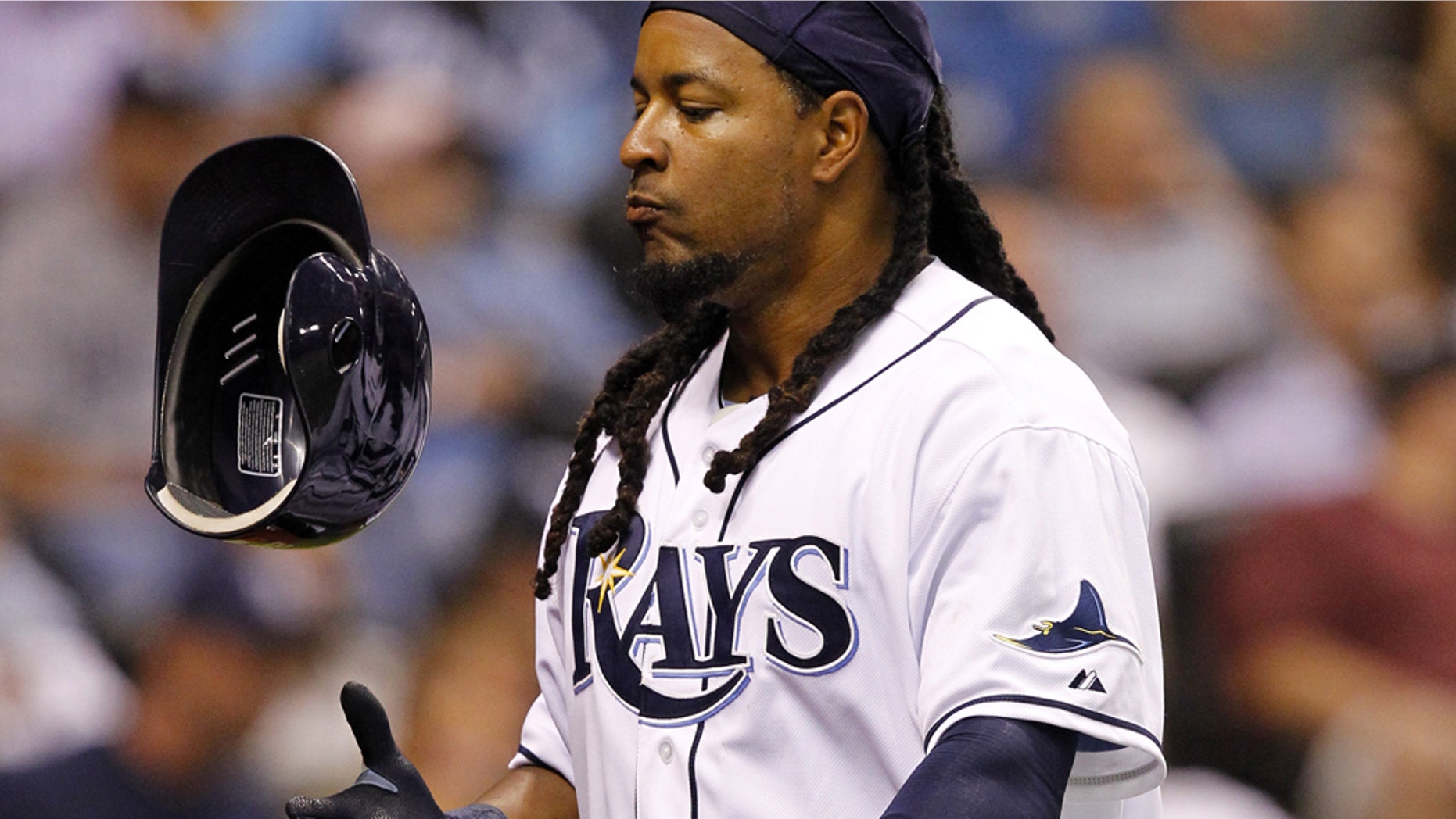 FILE - In tis April 5, 2011 file photo, Tampa Bay Rays' Manny Ramirez reacts after striking out in the fourth inning of a baseball game against the Los Angeles Angels in St. Petersburg, Fla. Ramirez has notified Major League Baseball that he is retiring after being notified of an issue under MLB's drug policy. The commissioner's office issued a statement Friday, APril 8, 2011, that said Ramirez decided to retire rather than go through MLB's Joint Drug Prevention and Treatment Program. (AP Photo/Mike Carlson, File)