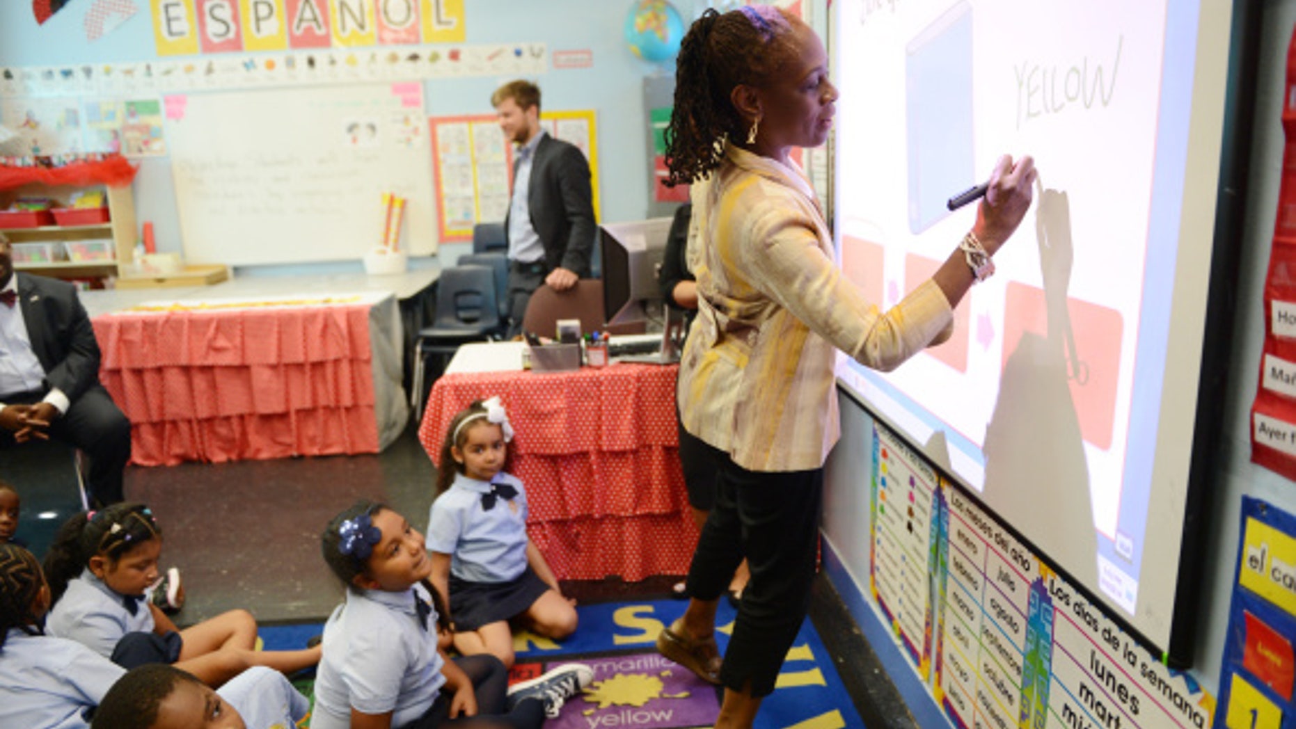 NEW YORK, NY - SEPTEMBER 4: First Lady Chirlane McCray plays a color naming game with students in a second grade Spanish class at Amber Charter School in Manhattan on the first day of NYC public schools, September 4, 2014 in New York City. New York Mayor Bill de Blasio is touring universal pre-kindergarten programs throughout the city. (Photo by Susan Watts-Pool/Getty Images)