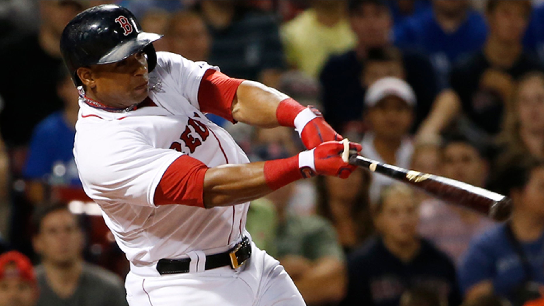 FILE - In this Sept. 6, 2014, file photo, Boston Red Sox's Yoenis Cespedes follows through on a RBI double against the Toronto Blue Jays during the third inning of a baseball game at Fenway Park in Boston. The Red Sox have agreed to trade outfielder Yoenis Cespedes to the Detroit Tigers for pitcher Rick Porcello, according to a person familiar with the negotiations. Right-handed pitching prospect Alex Wilson also will go to Detroit as part of the trade, the person said Thursday, Dec. 11, 2014, speaking on condition of anonymity because no announcement had been made. (AP Photo/Winslow Townson, File)