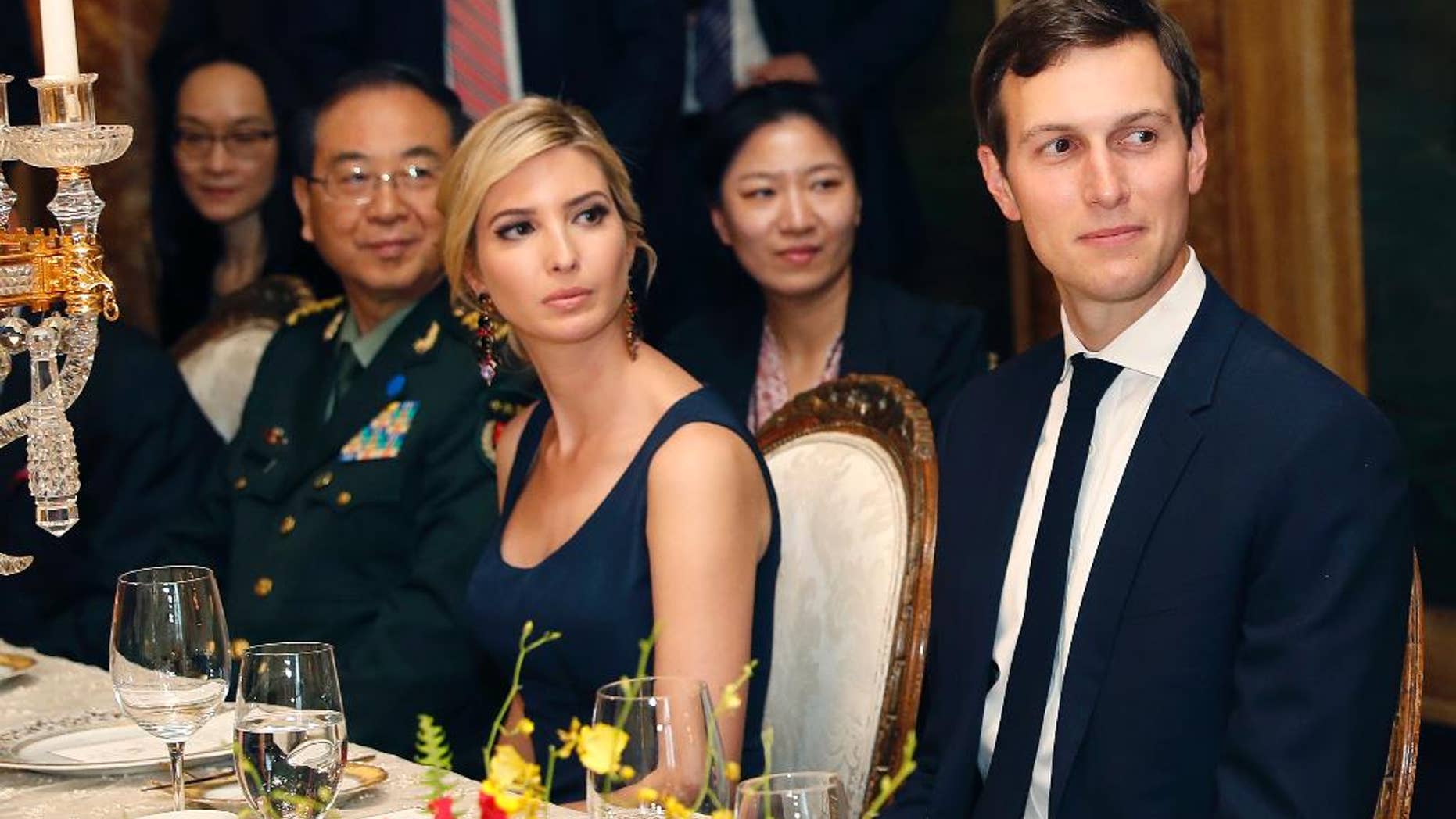 FILE - In this Thursday, April 6, 2017, file photo, Ivanka Trump, second from right, the daughter and assistant to President Donald Trump, is seated with her husband White House senior adviser Jared Kushner, right, during a dinner with President Donald Trump and Chinese President Xi Jinping, at Mar-a-Lago, in Palm Beach, Fla. China's Ministry of Foreign Affairs spokesman Lu Kang on Wednesday defended the handling of the applications of the trademarks won by U.S. President Donald Trump’s daughter Ivanka and her company, saying that all such requests are handled fairly. (AP Photo/Alex Brandon, File)