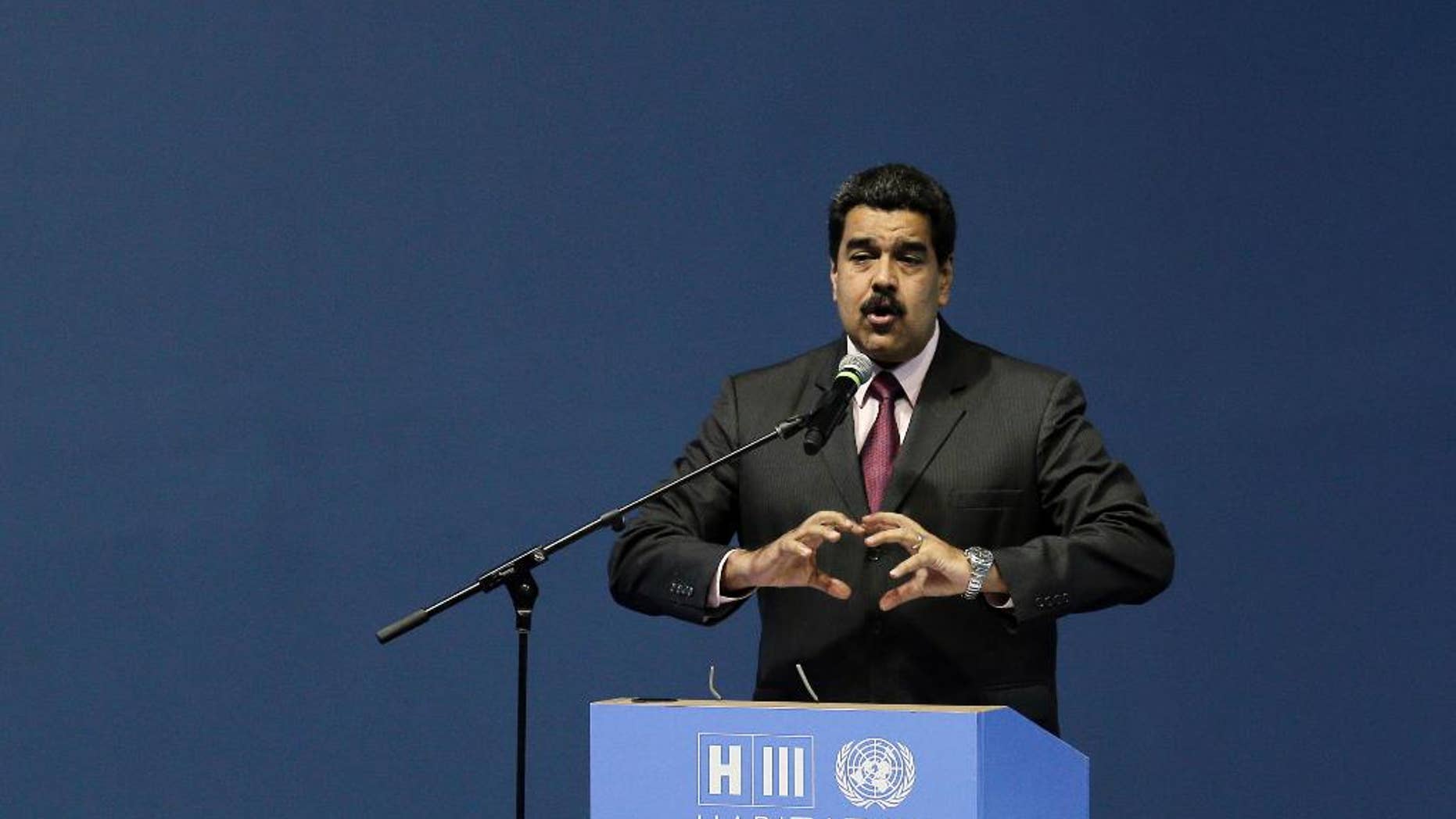 Venezuela's President Nicolas Maduro speaks during the opening of the third United Nations Habitat Conference, in Quito, Ecuador, Monday, Oct. 17, 2016. The meeting kicked off in Quito on Monday with the goal of tackling haphazard growth and fostering livable, self-sustaining cities amid a boom in the global urban population. (AP Photo/Dolores Ochoa)