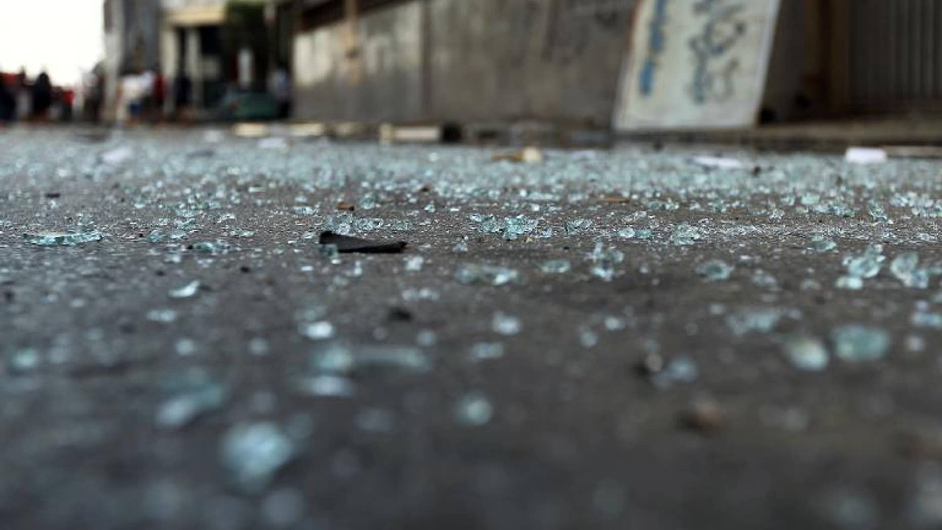 Glass pieces on the ground outside a foreign ministry building that was damaged by a powerful blast on September 11, 2013 in Benghazi.