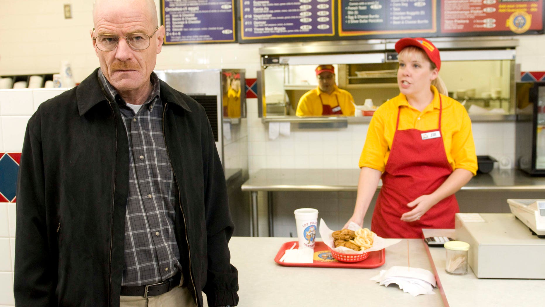 This image released by AMC shows Bryan Cranston as Walter White at the fictional restaurant "Los Pollos Hermanos" in a scene from season 2 of the AMC series "Breaking Bad."