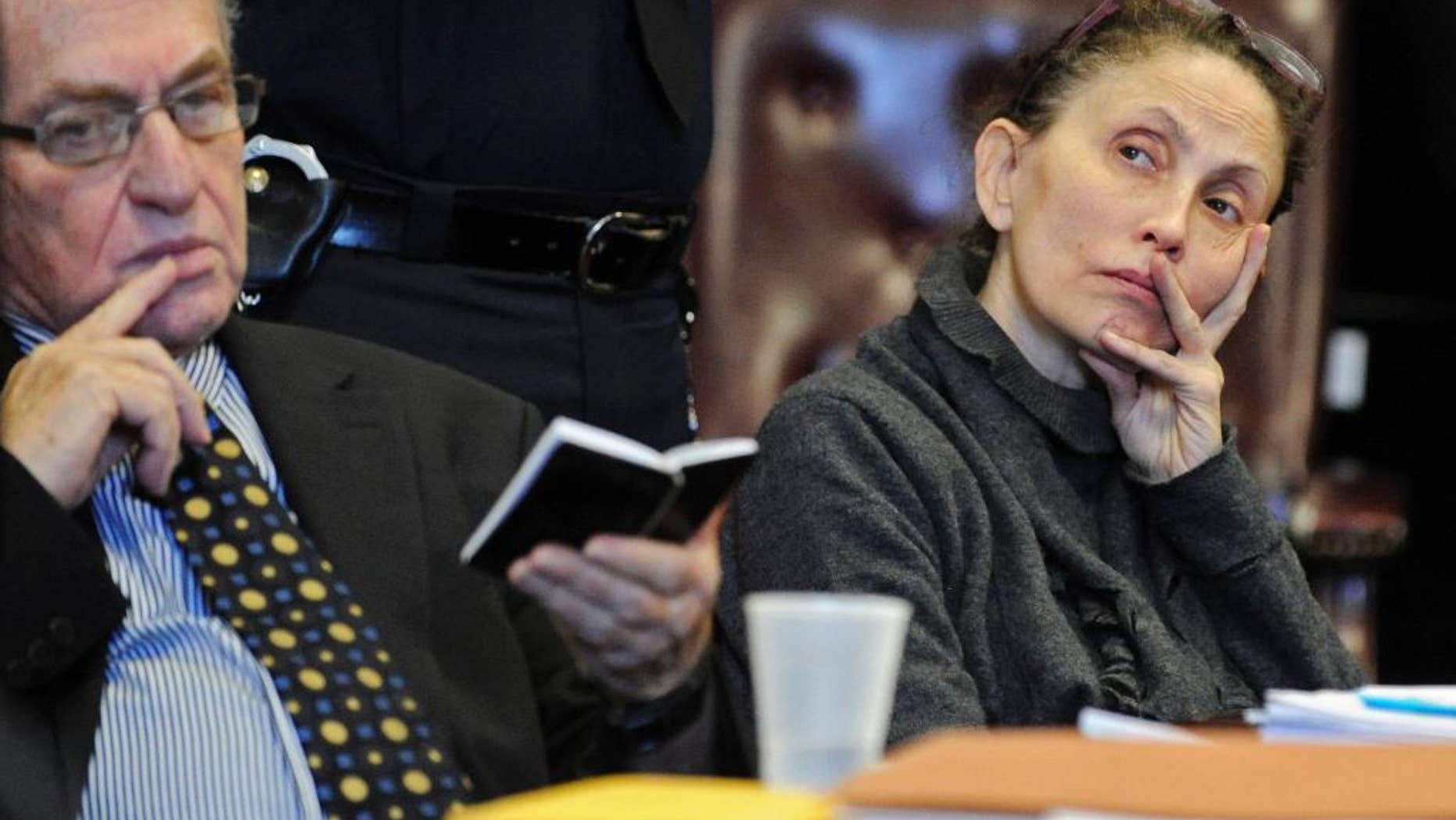 FILE - In this Dec. 23, 2011 file photo, Gigi Jordan, right, appears in Manhattan Supreme Court with her attorney Alan Dershowitz, Friday, Dec. 23, 2011, in New York. Jordan, a pharmaceuticals millionaire charged with killing her developmentally disabled son in a deluxe hotel room told jurors Wednesday, Oct. 8, 2014, that she didn't force drugs down his throat, as prosecutors maintain. Her son, Jude Mirra, was found dead of a drug overdose and Jordan was found on the floor in a pricey suite at Manhattan's Peninsula Hotel in February 2010. (AP Photo/ Louis Lanzano, Pool)