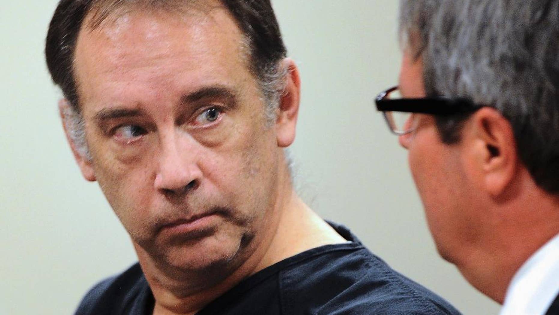 FILE - In this Aug. 5, 2014, file photo, former suburban Milwaukee police officer Steven Zelich, left, of West Allis, Wis., appears in court in Kenosha, Wis. Zelich, who is accused of killing two women and ditching their bodies in suitcases along a rural Wisconsin highway, pleaded guilty Friday, Feb. 3, 2017, in the slaying of one of the women at a Rochester, Minn., hotel in 2013. Zelich was sentenced to 25 years in prison. (Sean Krajacic /The Kenosha News via AP, File)