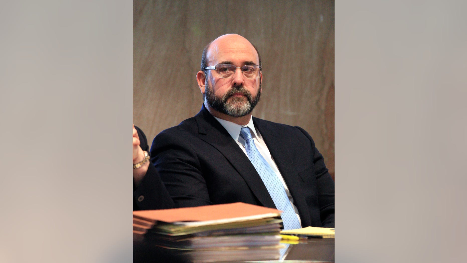 FILE - In this Monday, Nov. 18, 2013, file photo, Del City Police Capt. Randy Harrison looks at the jurors box in the courtroom during his trial at the Oklahoma County Courthouse in Oklahoma City. Harrison, charged with manslaughter in the death of an armed teen, "crossed the line" when he shot the man, prosecutors told jurors Monday, Nov. 25, 2013, while defense attorneys said the officer was trying to protect people and believed the teenager was reaching for a gun. (AP Photo/The Oklahoman, Paul B. Southerland, File)
