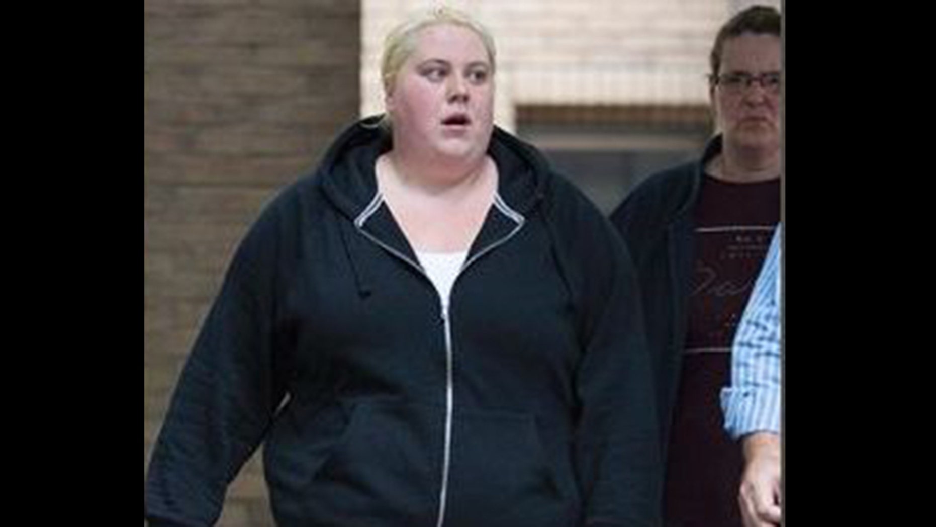 Jemma Beale walks to Southwark Crown Court in London for her trial on charges of perjury and perverting the course of justice.