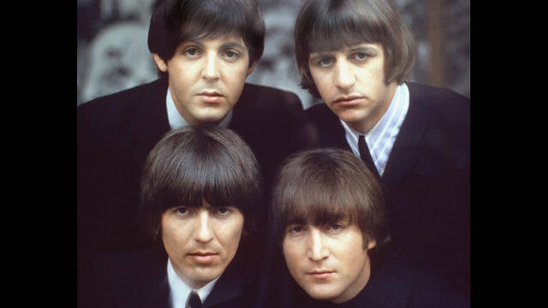 The Beatles are shown on an album cover in 1965. Clockwise, from top left, are: Paul McCartney, Ringo Starr, John Lennon, and George Harrison.