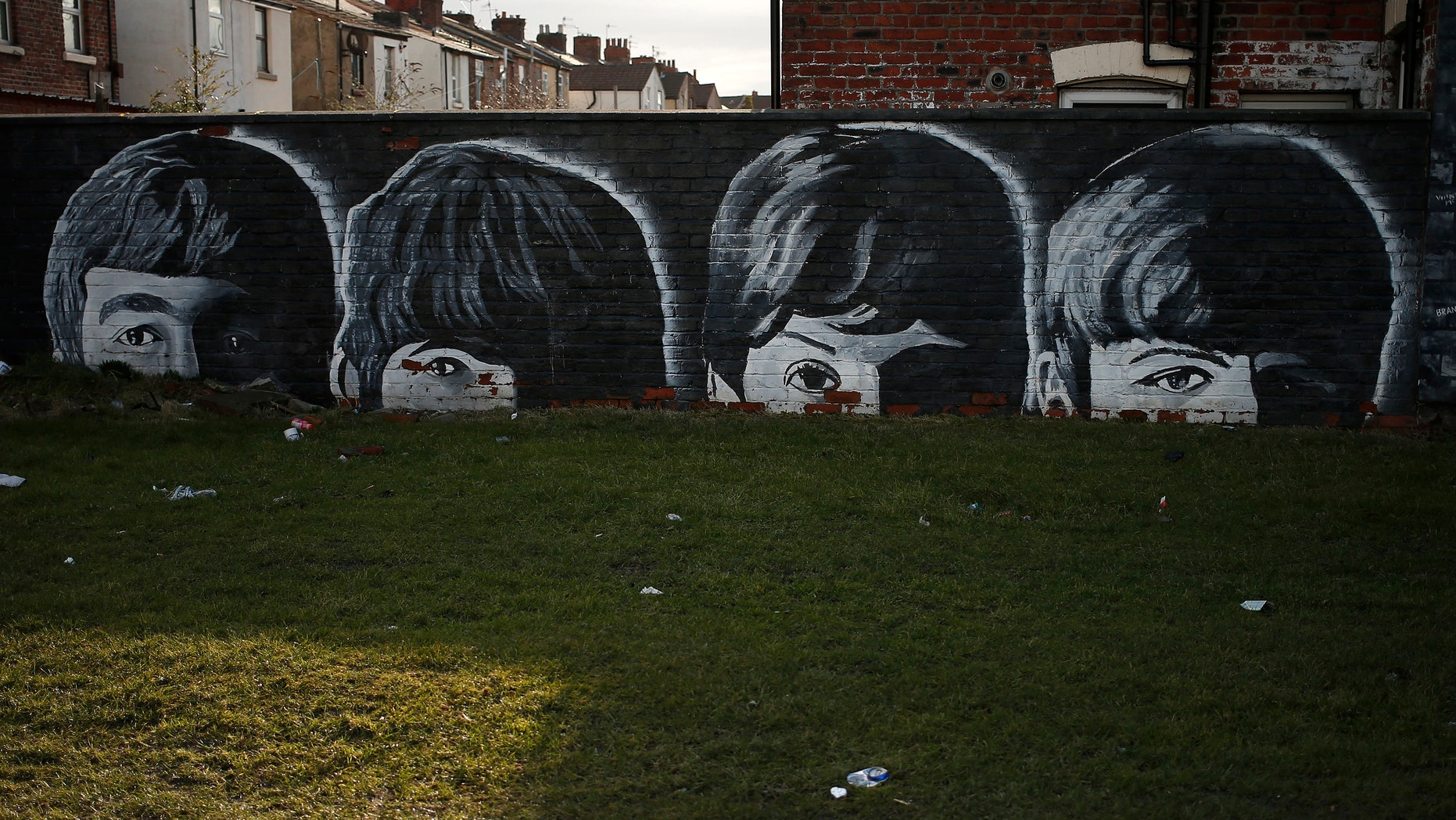 File phtoo - A mural of the Beatles is seen painted on the end of a row of terraced houses in Liverpool, northern England Feb. 18, 2015. (REUTERS/Phil Noble)