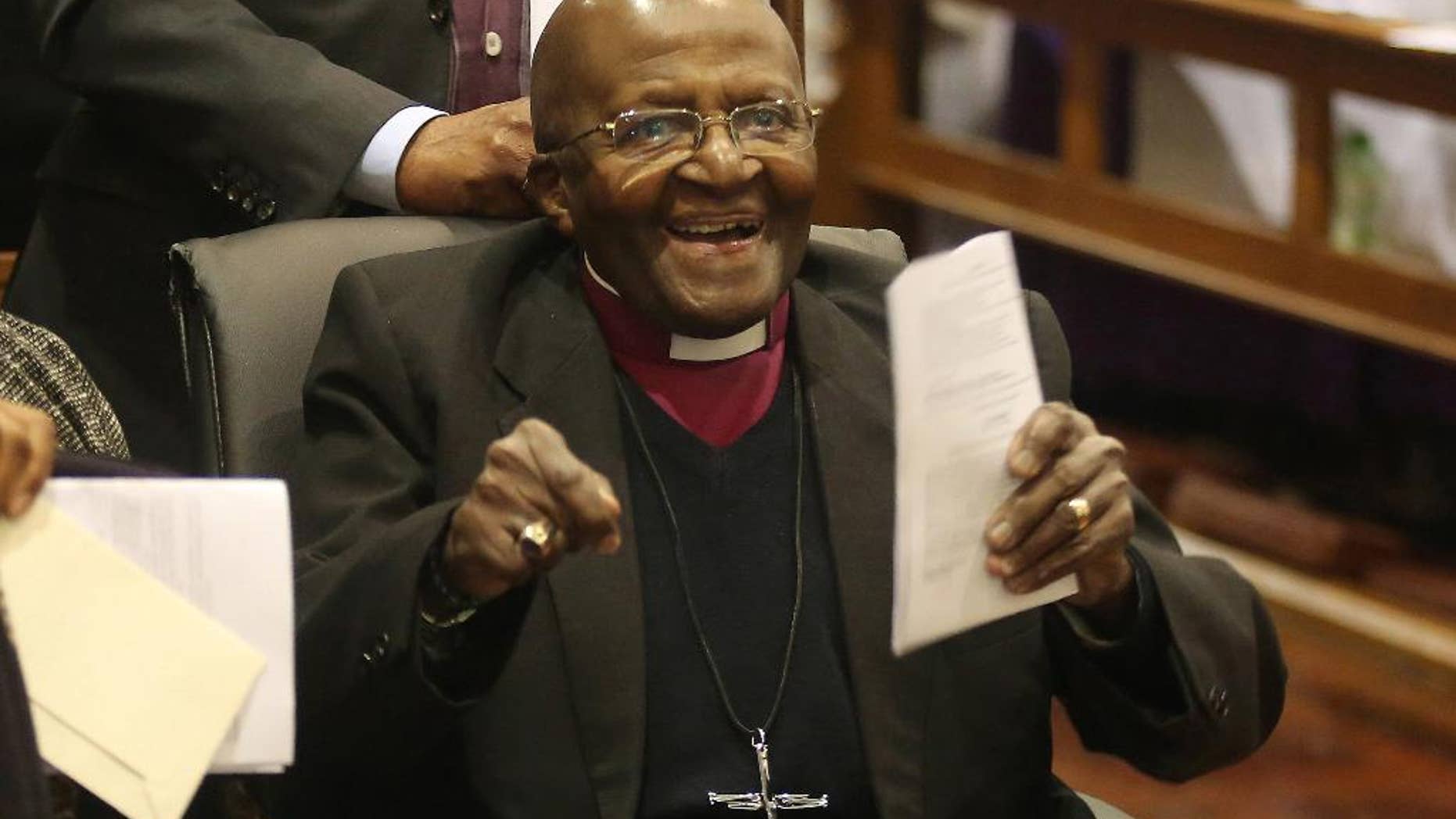 FILE -- In this July 10, 2016 file photo Anglican Archbishop Emeritus Desmond Tutu as he take part in a Mass as he celebrates four decades of episcopal ministry at a special thanksgiving Mass at St Mary's Cathedral in Johannesburg, The family of Tutu says he is responding well to treatment for an infection after checking into hospital two weeks ago. (AP Photo/Denis Farrell-File)