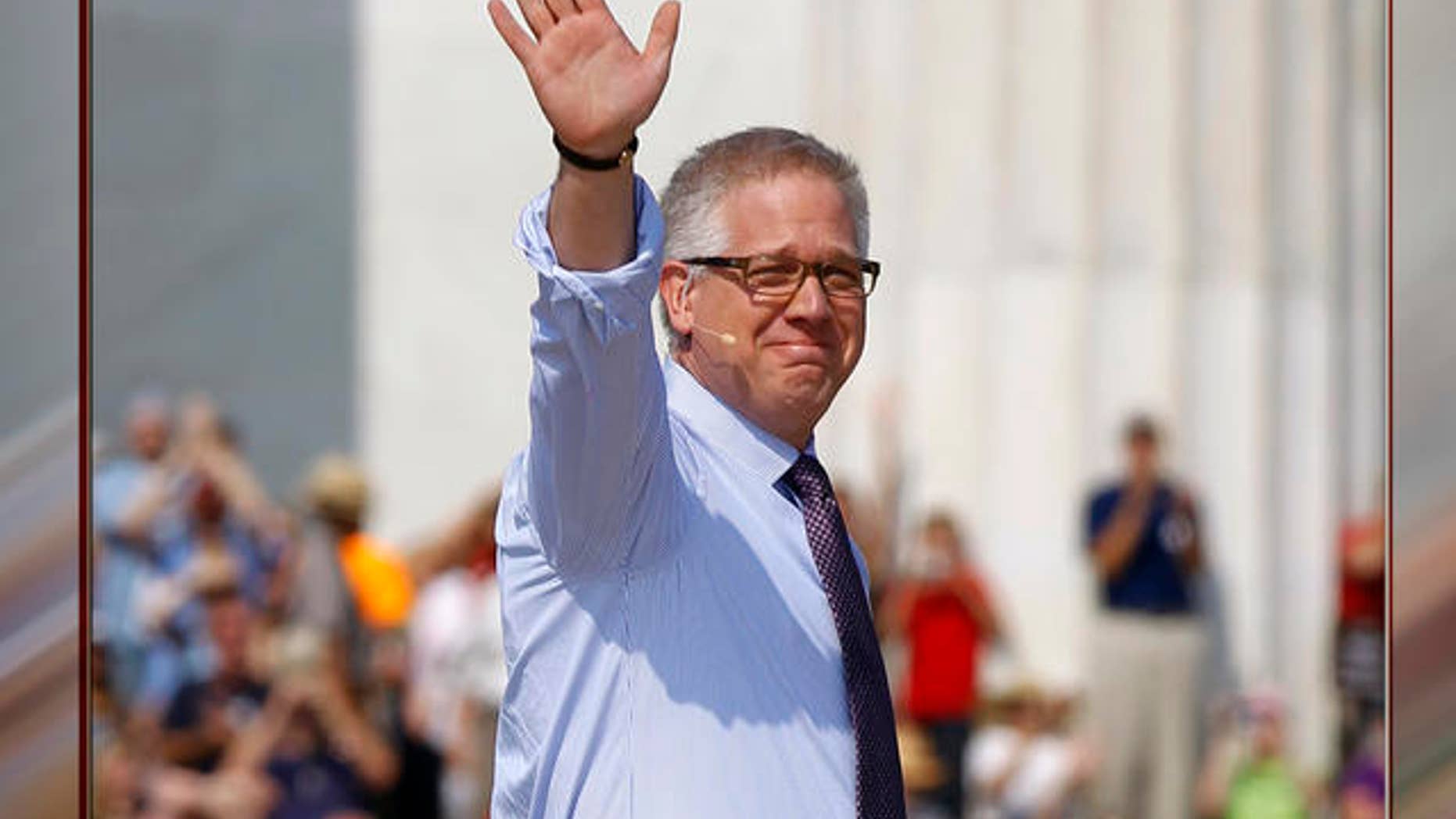 Glenn Beck waves as he arrives to speak at his 'Restoring Honor' rally in front of the Lincoln Memorial in Washington.
