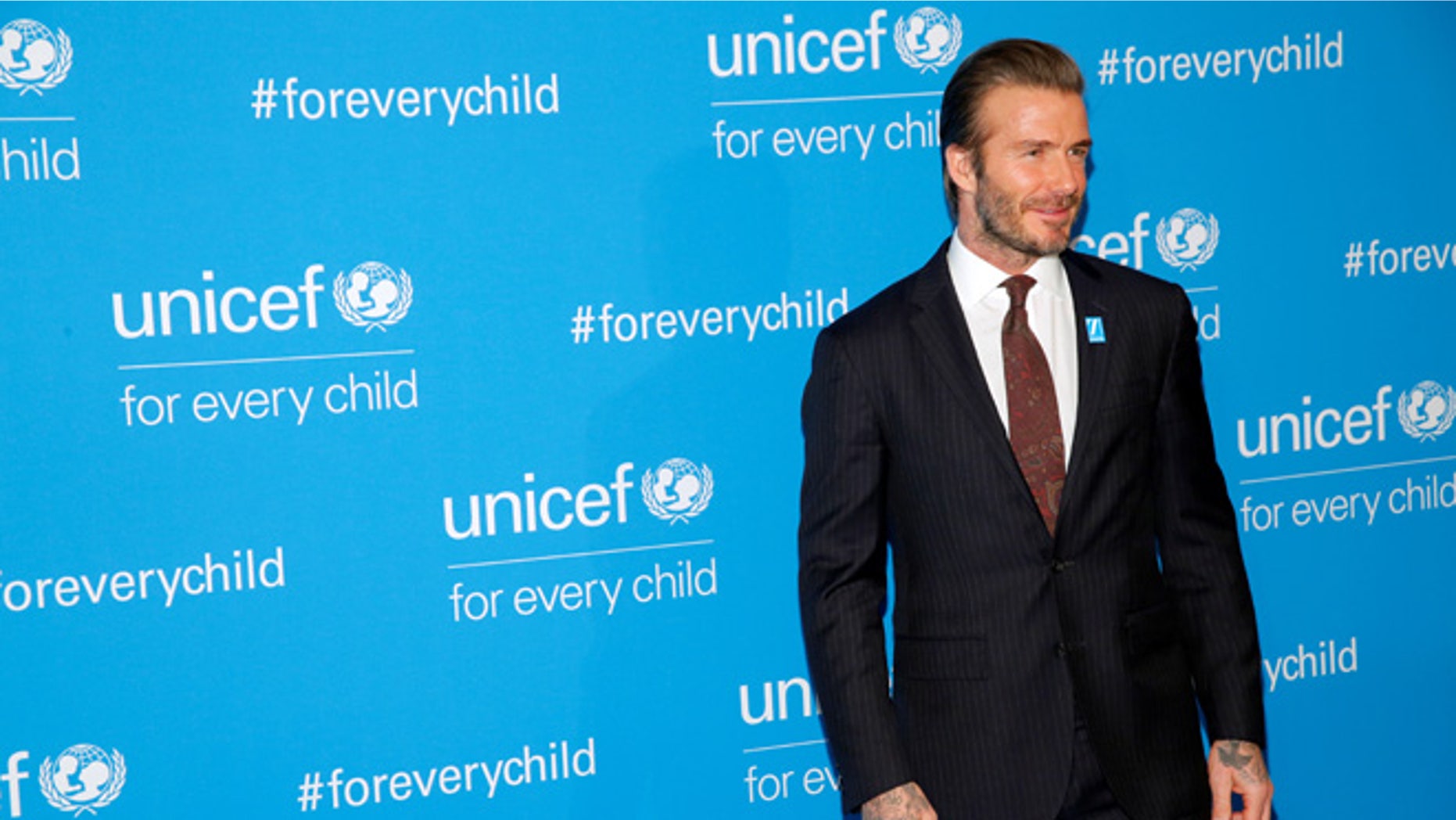 David Beckham is denying claims he used his relationship with UNICEF to campaign for knighthood.