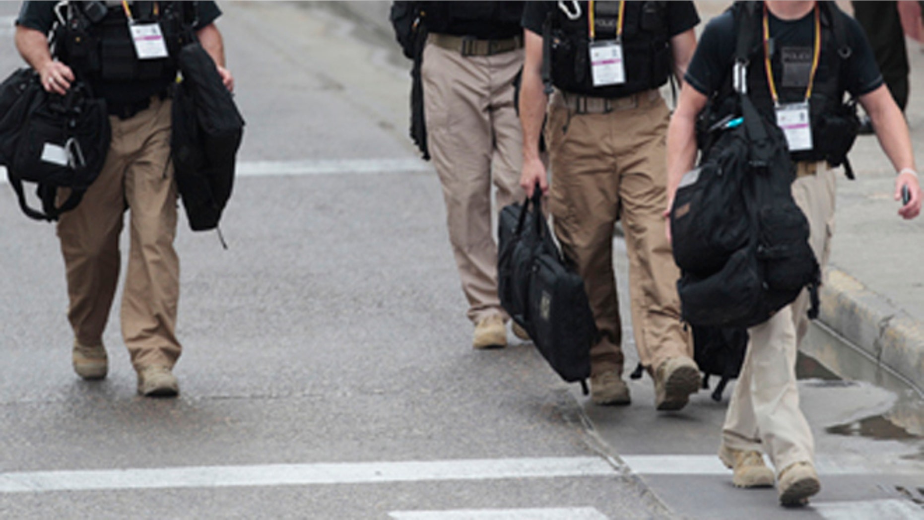 April 14, 2012: U.S. Secret Service agents walk around the Convention Center in Cartagena, Colombia, prior to the Summit of the Americas.