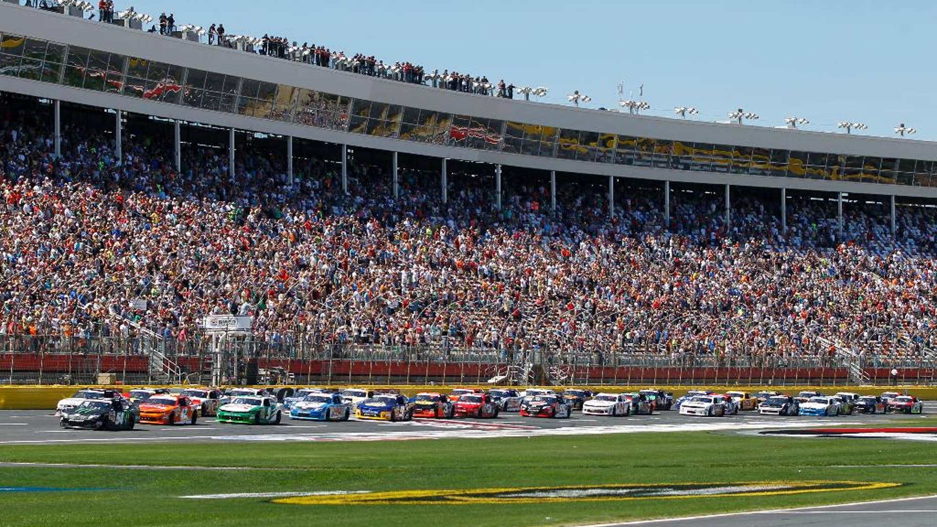 The field takes the green flag to start the NASCAR Nationwide series History 300 auto race at Charlotte Motor Speedway in Concord, N.C., Saturday, May 24, 2014. (AP Photo/Terry Renna)