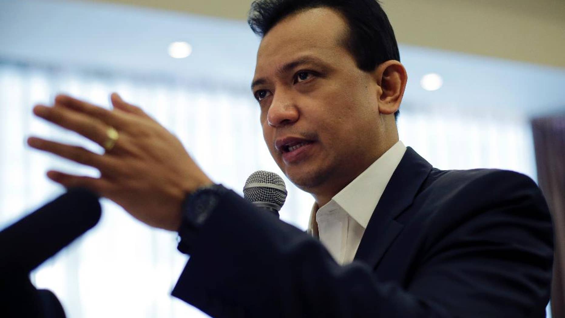 Philippine Sen. and vice presidential candidate Antonio Trillanes IV gestures as he answers questions during a forum with the Foreign Correspondents Association of the Philippines in Manila, Philippines Tuesday, May 3, 2016. Trillanes alleged that the Philippine presidential front-runner Rodrigo Duterte had a large sum of money in an undeclared bank account. The allegations have not been resolved Monday, allowing the issue to hang over the final week of the closely fought presidential race. (AP Photo/Aaron Favila)