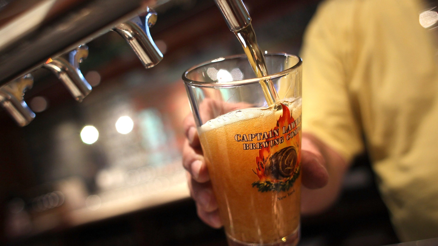 ELMSFORD, NY - MAY 03: A pint of beer is poared at the Captain Lawrence Brewing Company on May 3, 2012 in Elmsford, New York. Microbreweries in New York state will now have to pay an extra 14 cents per gallon in tax, after a state court ruled against tax ememptions for in-state breweries. The costs are expected to be passed on to consumers. (Photo by John Moore/Getty Images)