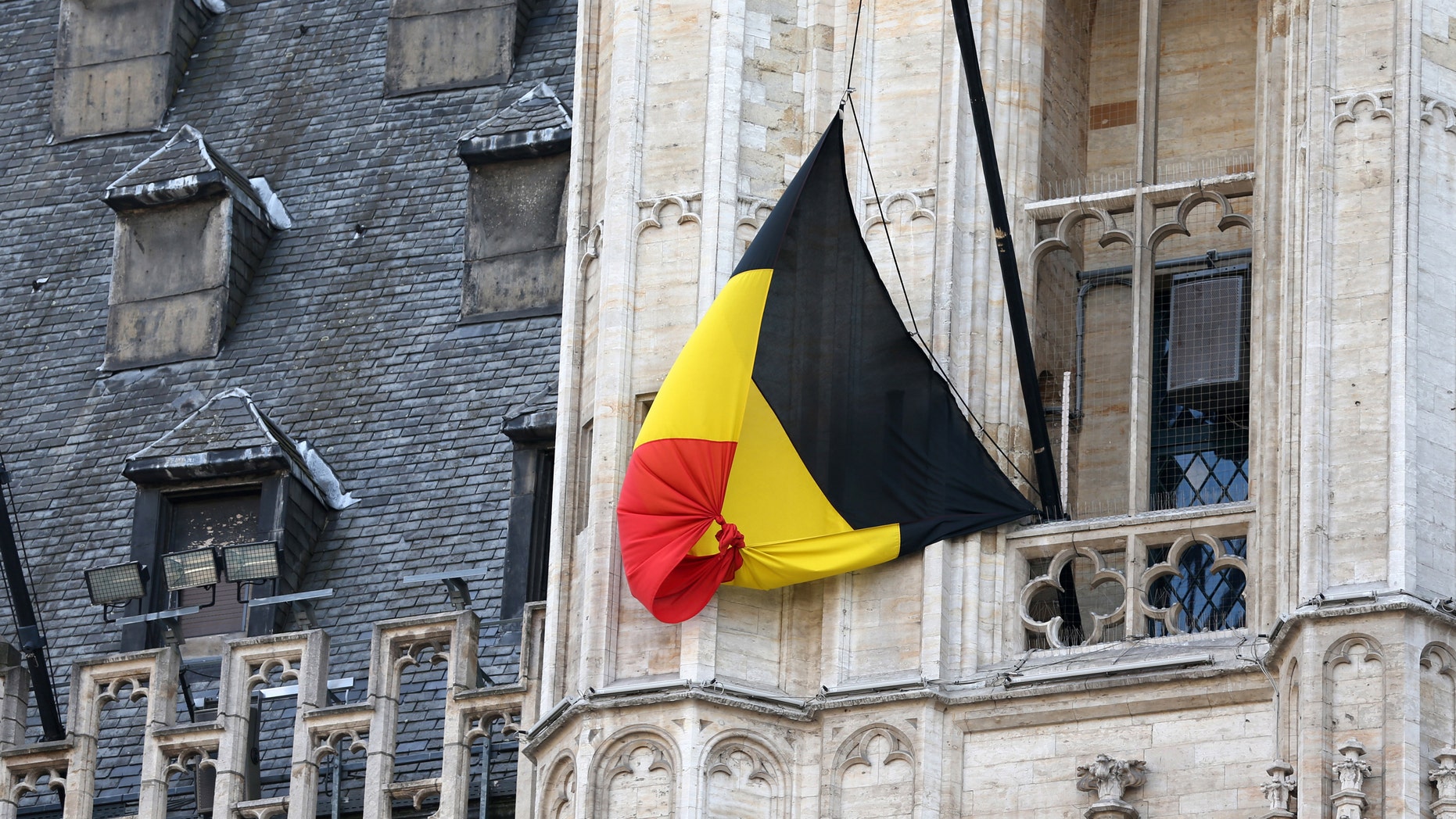 A Belgian flag flies at half-mast following bomb attacks s in Brussels, Belgium, March 22, 2016.(REUTERS/Charles Platiau)