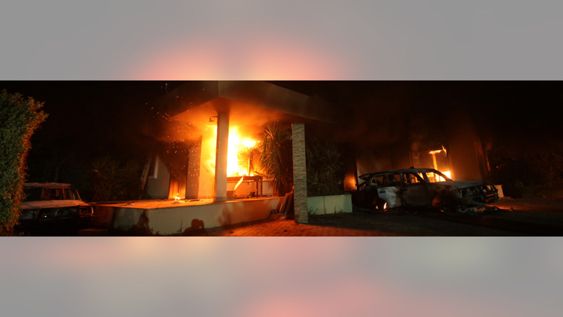 The U.S. Consulate in Benghazi is seen in flames during a protest by an armed group said to have been protesting a film being produced in the United States September 11, 2012. An American staff member of the U.S. consulate in the eastern Libyan city of Benghazi has died following fierce clashes at the compound, Libyan security sources said on Wednesday. Armed gunmen attacked the compound on Tuesday evening, clashing with Libyan security forces before the latter withdrew as they came under heavy fire. REUTERS/Esam Al-Fetori (LIBYA - Tags: POLITICS CIVIL UNREST) - RTR37UW6